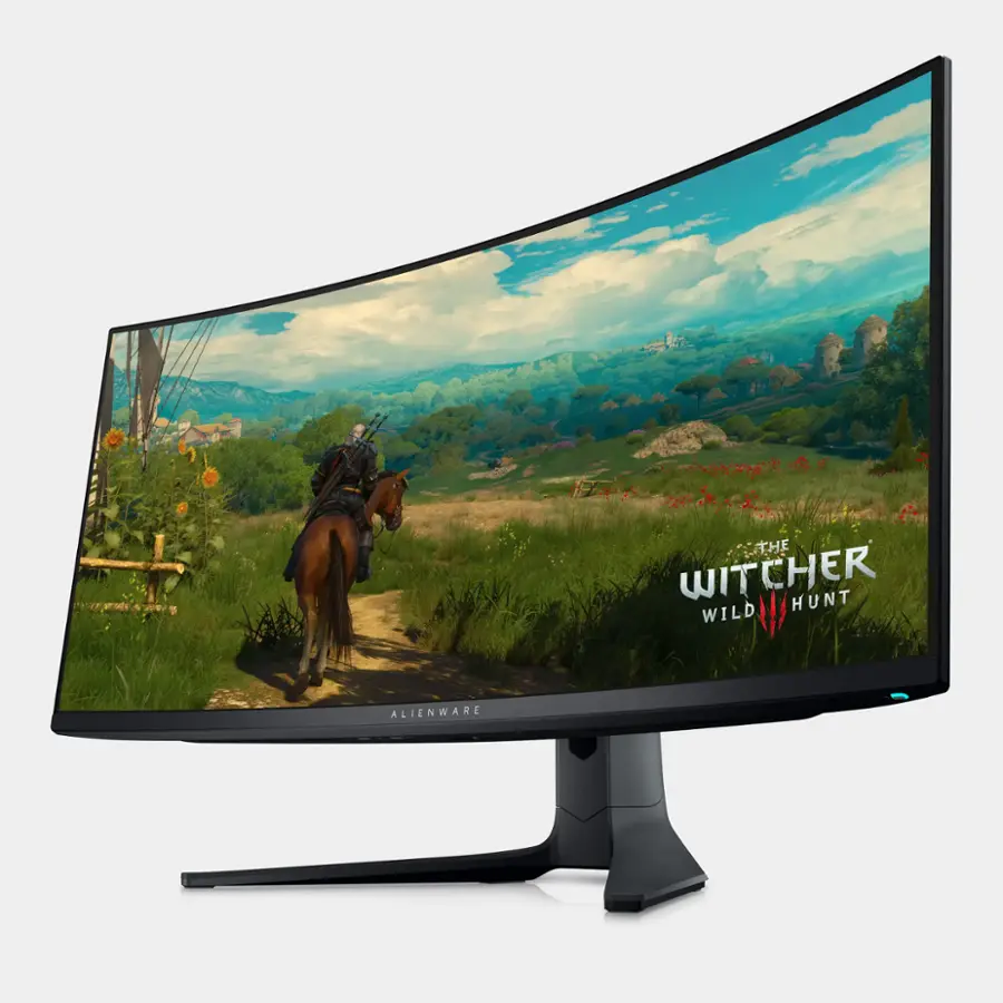 The Witcher 3: Wild Hunt is a video game that features a man riding a horse. The game is displayed on an Alienware computer monitor, which is known for its high-quality graphics and performance. The monitor is curved, providing an immersive gaming experience.