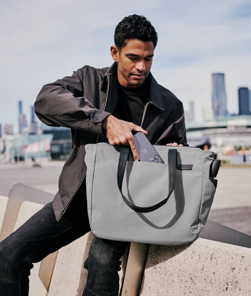Alt View 1. ALPAKA - Metro Tote Laptop Tote Bag for Work, Work Tote Fits 16" MacBook Pro, Side Bottle Pocket, Weather-Resistant, Key Tether - Grey Axoflux 210D.