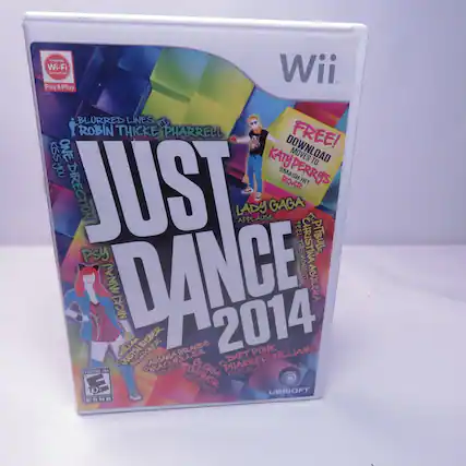 The text on the image is a list of artists and songs featured in the game "Just Dance 2014" for the Nintendo Wii. Here is the corrected and grouped text:
- Nintendo Wi-Fi Connection
- Pay & Play
- Just Dance 2014
- Blurred Lines - Robin Thicke, Pharrell
- One Direction - Kiss You
- Katy Perry - Smash, Roar
- Lady Gaga - Applause, Feel, Bad Romance
- Christina Aguilera - Moves Like Jagger
- Pitbull - International Love
- Psy - Gangnam Style
- Nicki Minaj - Moment 4 Life
- Justin Bieber - Boyfriend
- Ariana Grande - The Way
- Daft Punk - Lucky
- Pharrell Williams - Happy
- Will.I.Am - Just a Dance
- Gloria Estefan - Conga
- Kari Jobe - We Are Not Alone
- Ubisoft
The text on the image is a promotional cover for the game, listing the featured songs and artists. - E (Everyone)