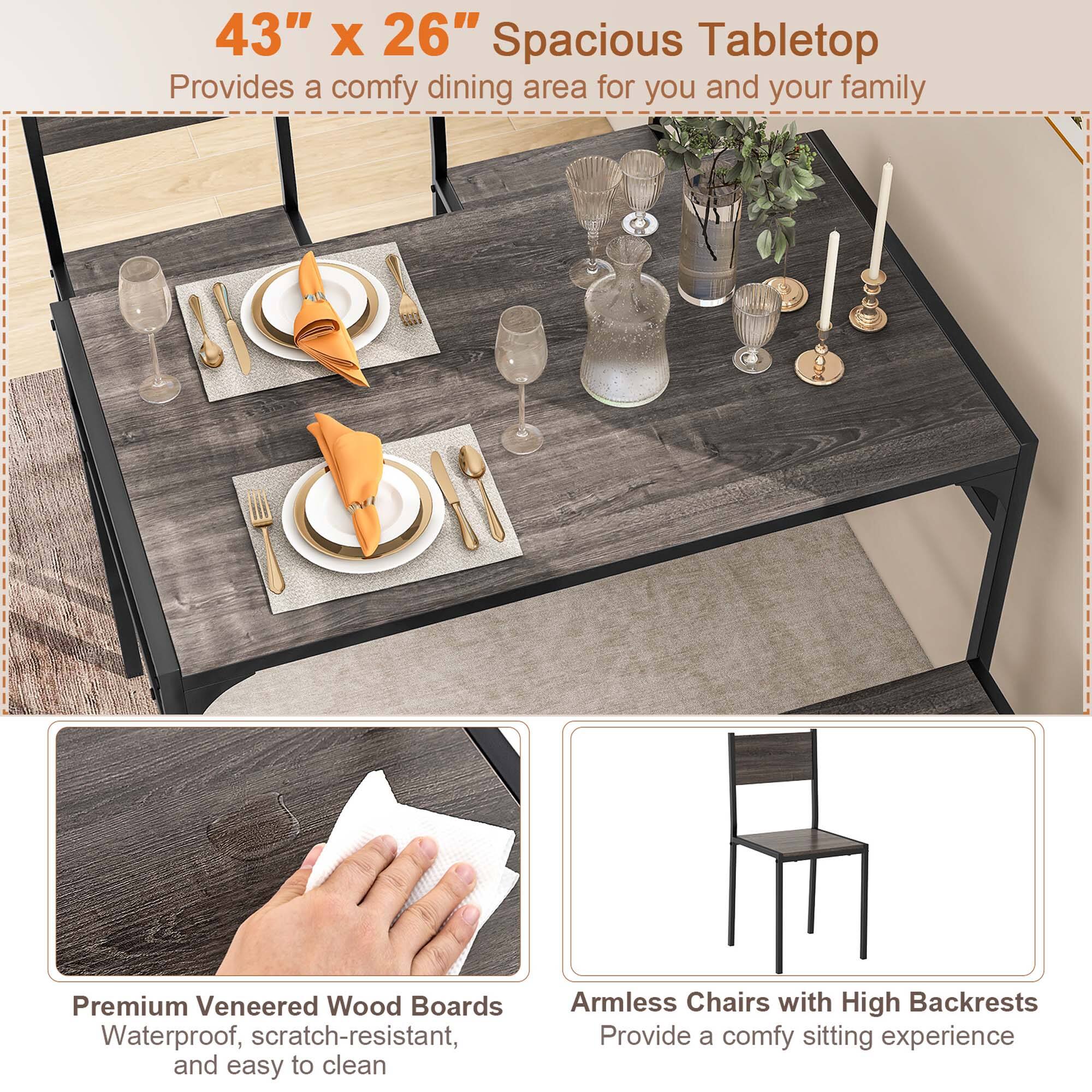 The image features a wooden dining table with a 43" x 26" spacious tabletop, providing a comfortable dining area for you and your family. The table is accompanied by premium veneered wood boards that are waterproof, scratch-resistant, and easy to clean. The table is also adorned with various items such as wine glasses, cups, and a potted plant, creating an inviting atmosphere for dining. The table is surrounded by chairs, including two armless chairs with high backrests, offering a comfortable sitting experience for those who use them.