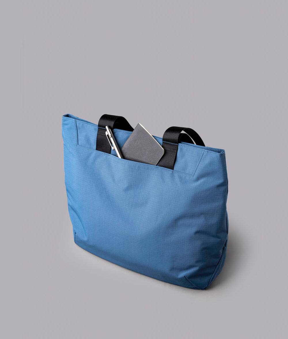 Alt View 5. ALPAKA - Elements Tote Bag 14.5L Weatherproof Foldable Travel Tote with Magnetic Closure - Blue/G Axoflux 210D.