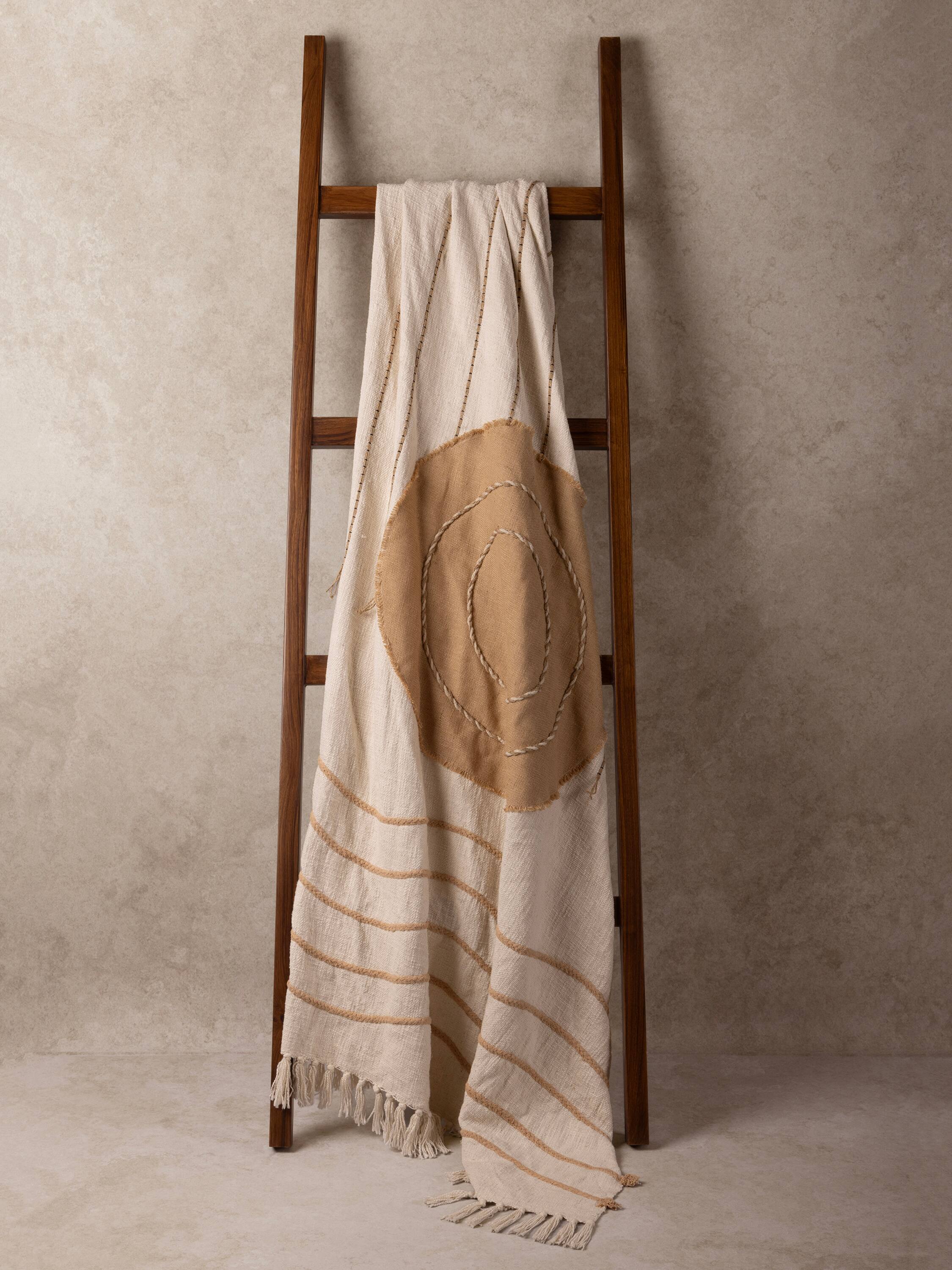 Angle. GAURI KOHLI - Zoya Throw Blanket - Shades of beige and brown.