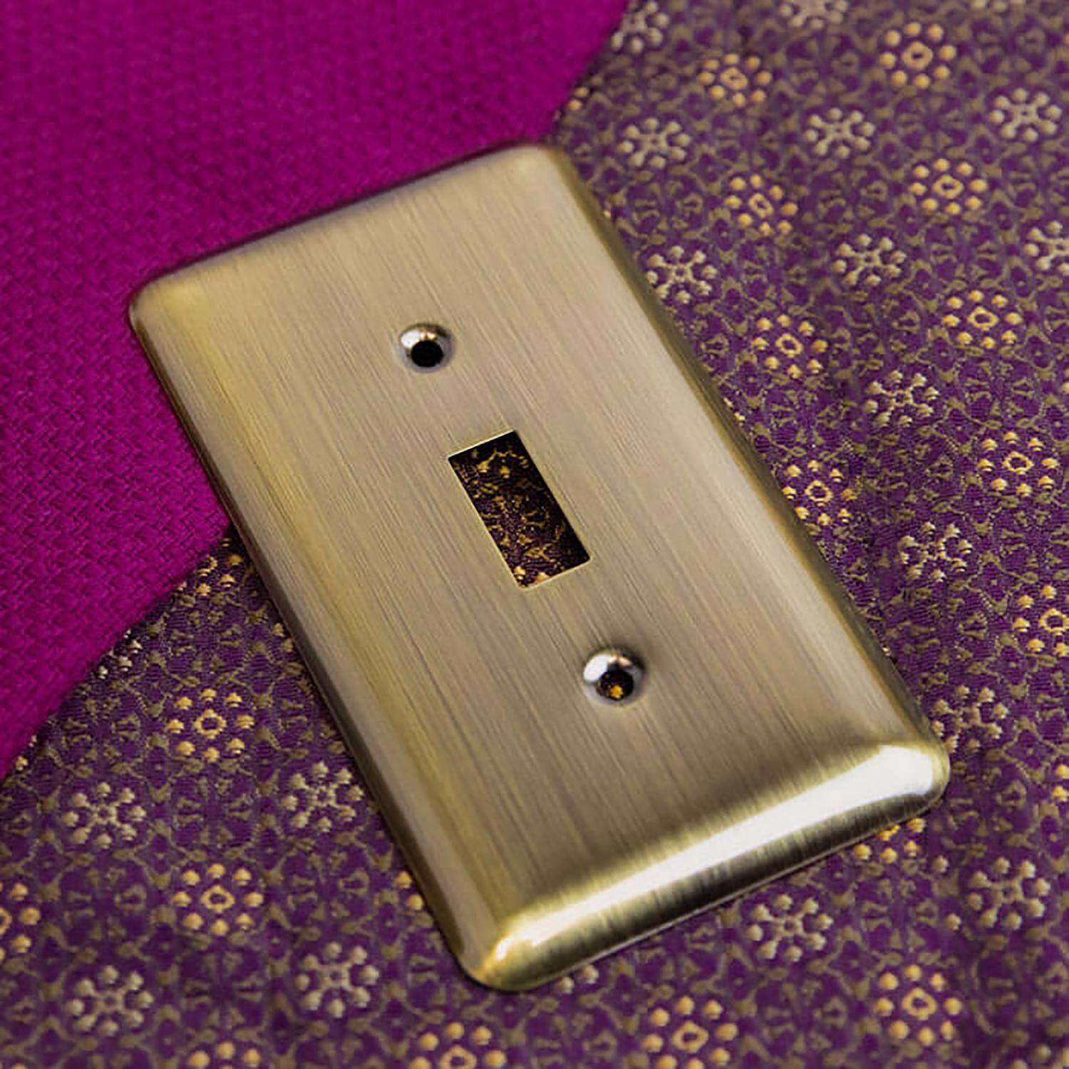 Left. AMERELLE - Amerelle Devon Brushed Brass 2 gang Stamped Steel Decorator/Toggle Wall Plate 1 pk - Brass.