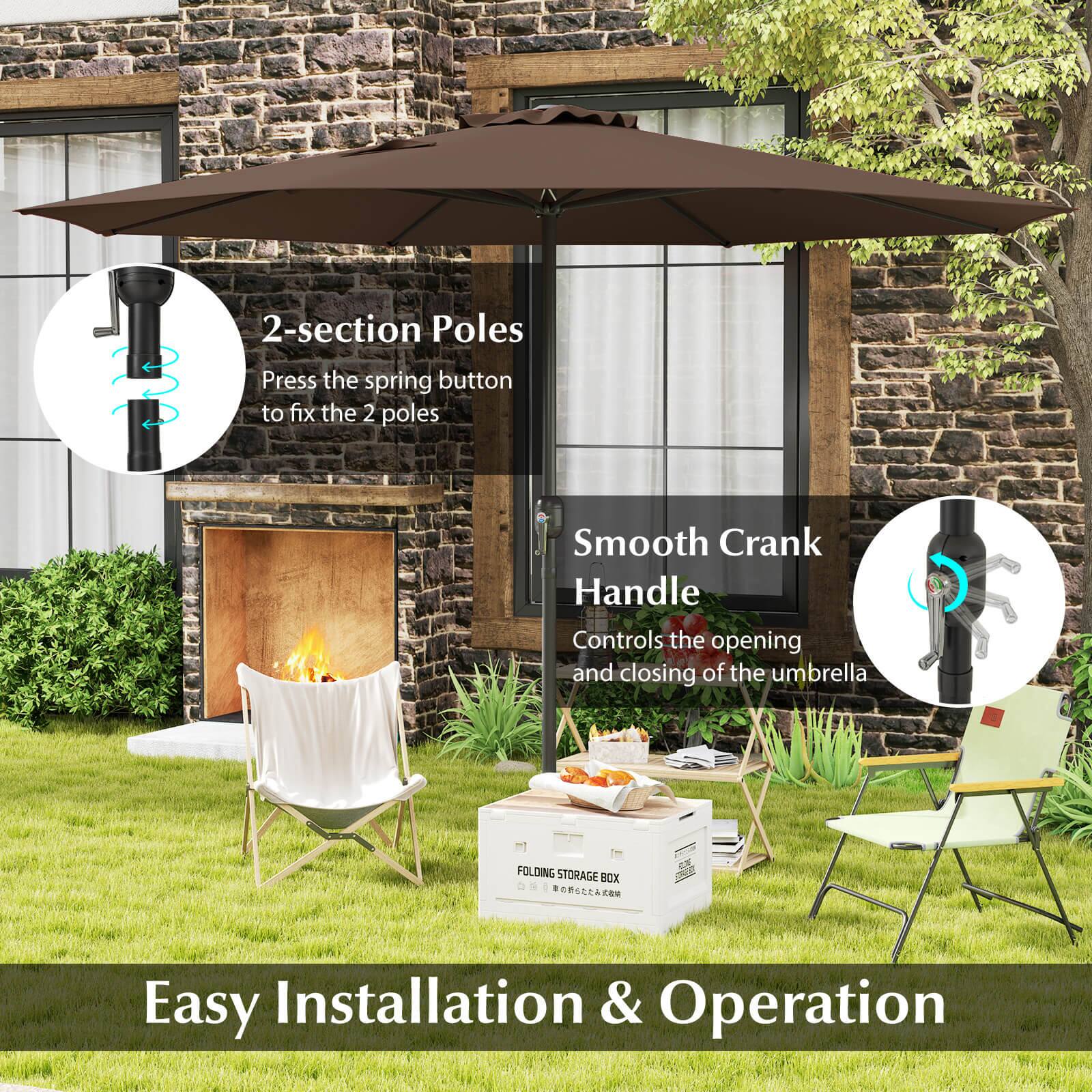 The image features an outdoor setting with a brick building, a fireplace, and a patio. There is a patio umbrella with a 2-section pole and a smooth crank handle, which allows for easy installation and operation. The umbrella is open and ready to provide shade or protection from the elements. Additionally, there is a folding storage box nearby, which can be used for storing items or as a table. The scene also includes chairs and a dining table, creating a comfortable outdoor space for relaxation and dining.
