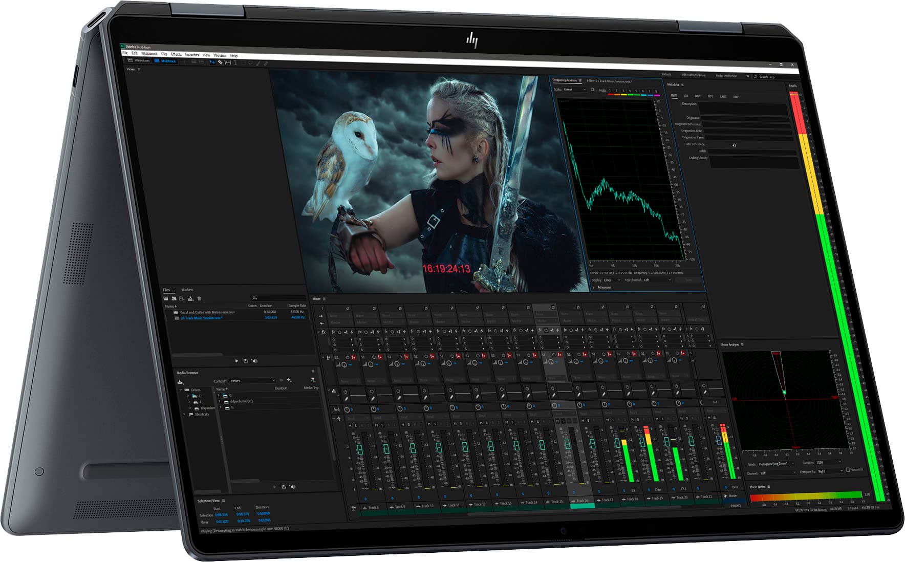 A laptop screen displays a woman with a bird on her shoulder. The image is set against a dark background, and the woman is holding a sword. The time shown on the screen is 16:19:24:13.