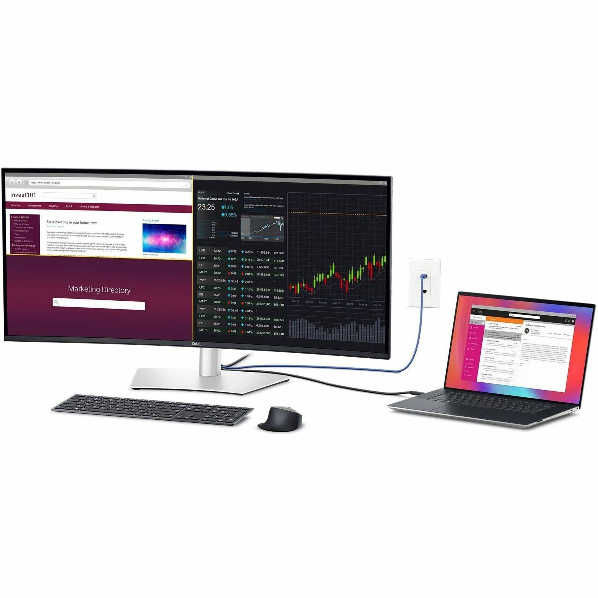 The image shows a computer setup with a laptop and a desktop computer. The laptop is connected to the desktop computer, which has a monitor and a keyboard. The laptop is also connected to a mouse. The desktop computer has a monitor displaying the Marketing Directory. The laptop is open to a webpage, and there is a mouse on the desk.