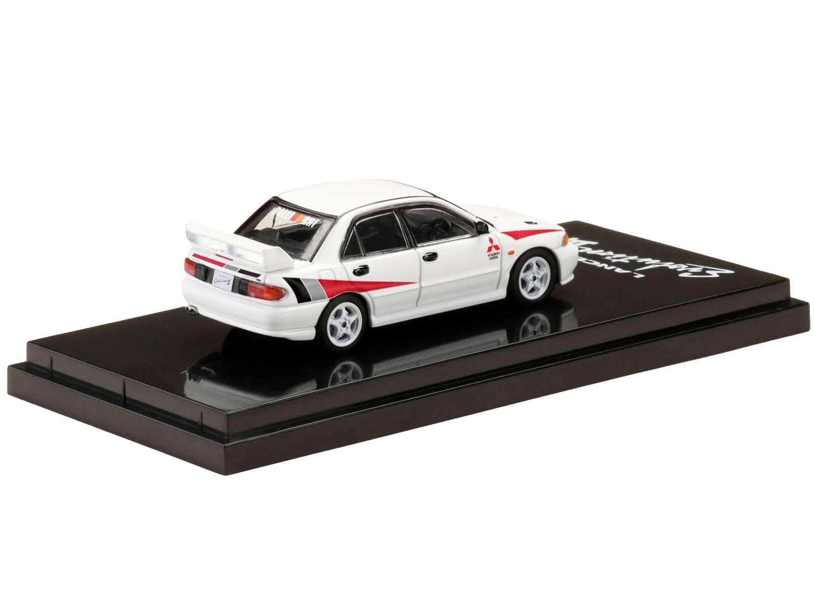 Angle. Hobby Japan - Mitsubishi Lancer RS Evolution III RHD (Right Hand Drive) Scortia White with Red Rally Stripes 1/64 Diecast Model Car - White with Red.