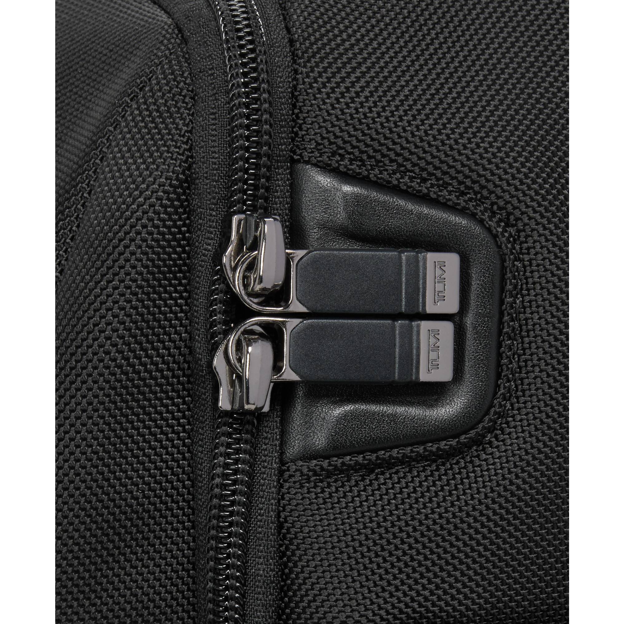 The text on the image reads: "TUMI"