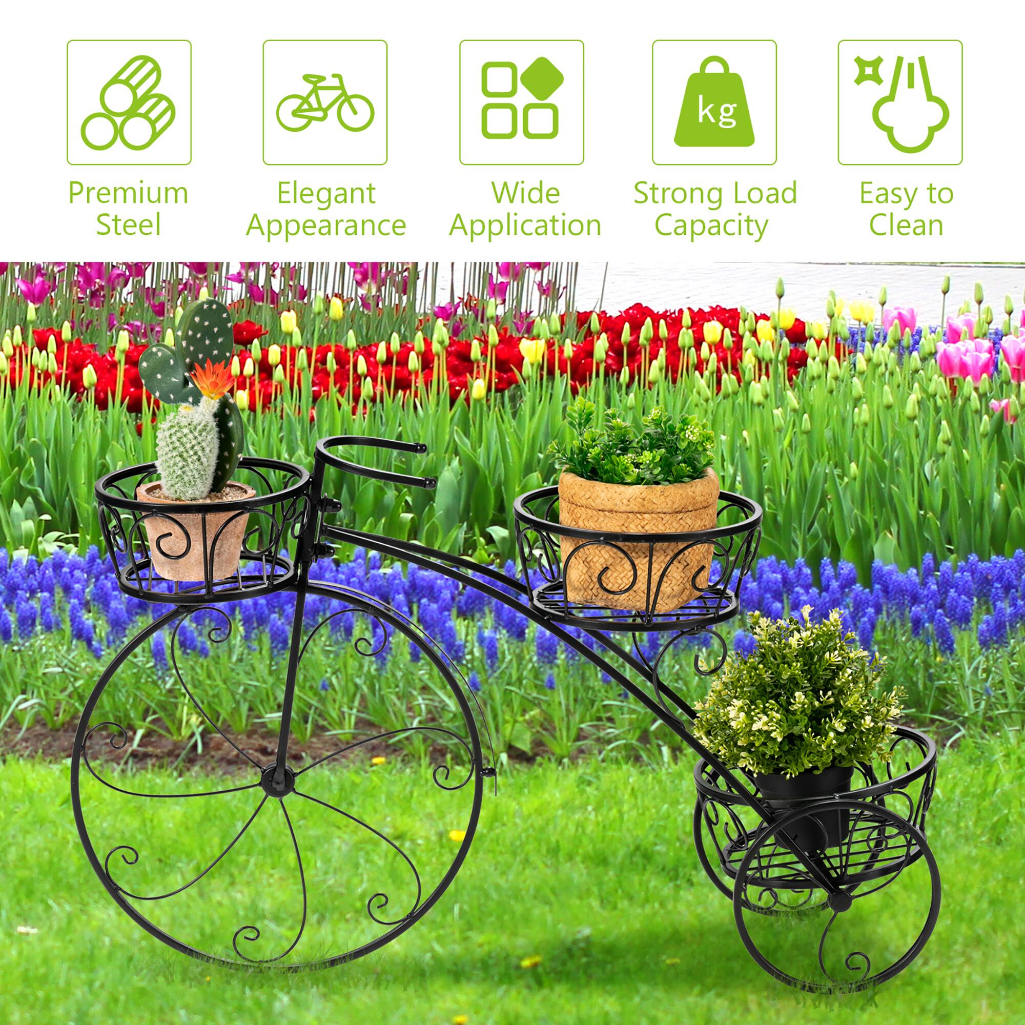 The image features a bicycle with a basket attached to it, holding various potted plants and flowers. The bicycle is described as having a premium, elegant, and wide strong load steel appearance, with easy-to-clean features. The basket is filled with a variety of potted plants, including a cactus, and the bicycle is parked on a grassy area.