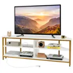 The image features a flat screen TV placed on a wooden stand. The stand has a shelf underneath the TV, which is filled with various items. There are several books arranged on the shelf, with some placed closer to the TV and others further away. Additionally, there are two cups, one near the left side of the shelf and the other near the right side. A clock is also present on the left side of the shelf, adding to the overall decoration of the space.