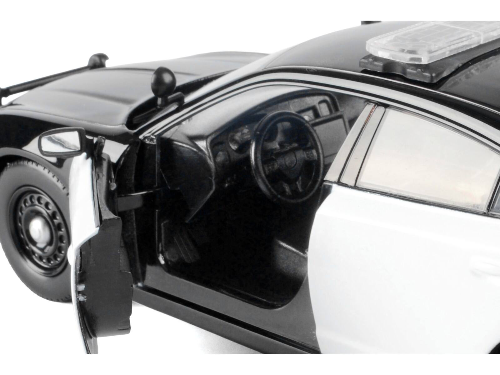 Angle. Motormax - 2023 Dodge Charger Pursuit Police Car Black and White "Law Enforcement and Public Service" Series 1/24 - Black and White.