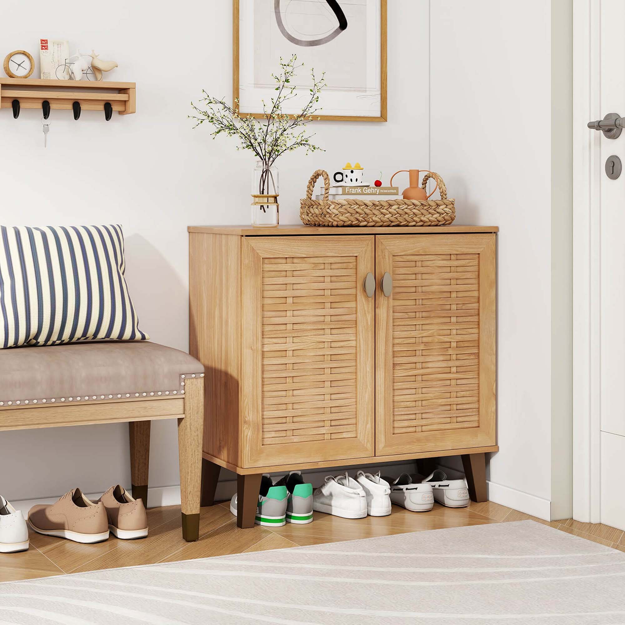The image shows a room with a bench and a dresser. The bench is located next to the dresser, which has a basket on top of it. The room also features a door and a clock hanging on the wall. There are several pairs of shoes placed on the floor in front of the dresser, with a total of nine shoes visible in the scene. The room appears to be a part of a house, and the arrangement of the furniture and items suggests a cozy and functional living space.