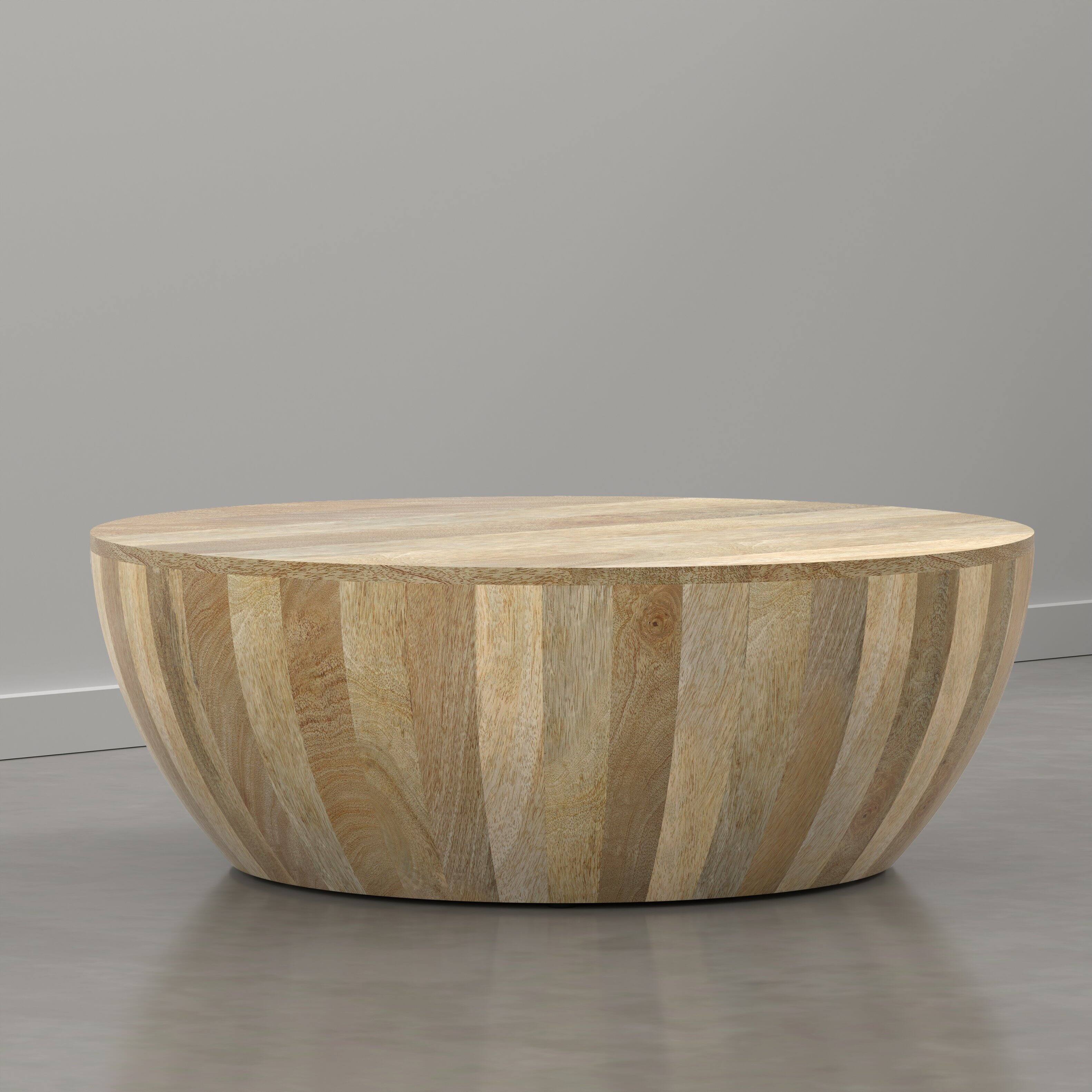 Angle. Simpli Home - Elmbrook 34 inch Wide Solid Mango Wood Drum Coffee Table, Natural Blonde - Natural Blonde.