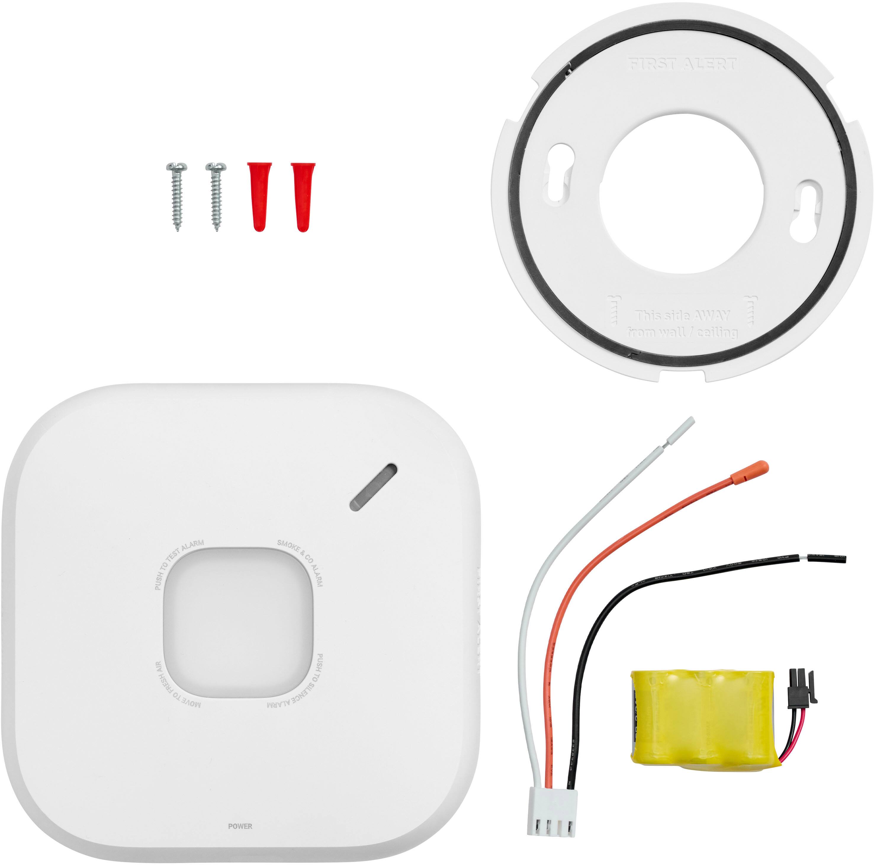 The image shows a collection of electronic components and wires, including a white box, a speaker, a power supply, and a yellow battery. The components are arranged in a way that suggests they are part of an alarm system or a home security system. The text on the image reads "This ThissHdeAWAY aidla AWAY  Iram wall I coiling ALARM EST e  BOKE - S ALARM We RESH iB SAOY PUBY TO PRT  ZONEYS POWER." This text might be related to the alarm system or the components' functions.