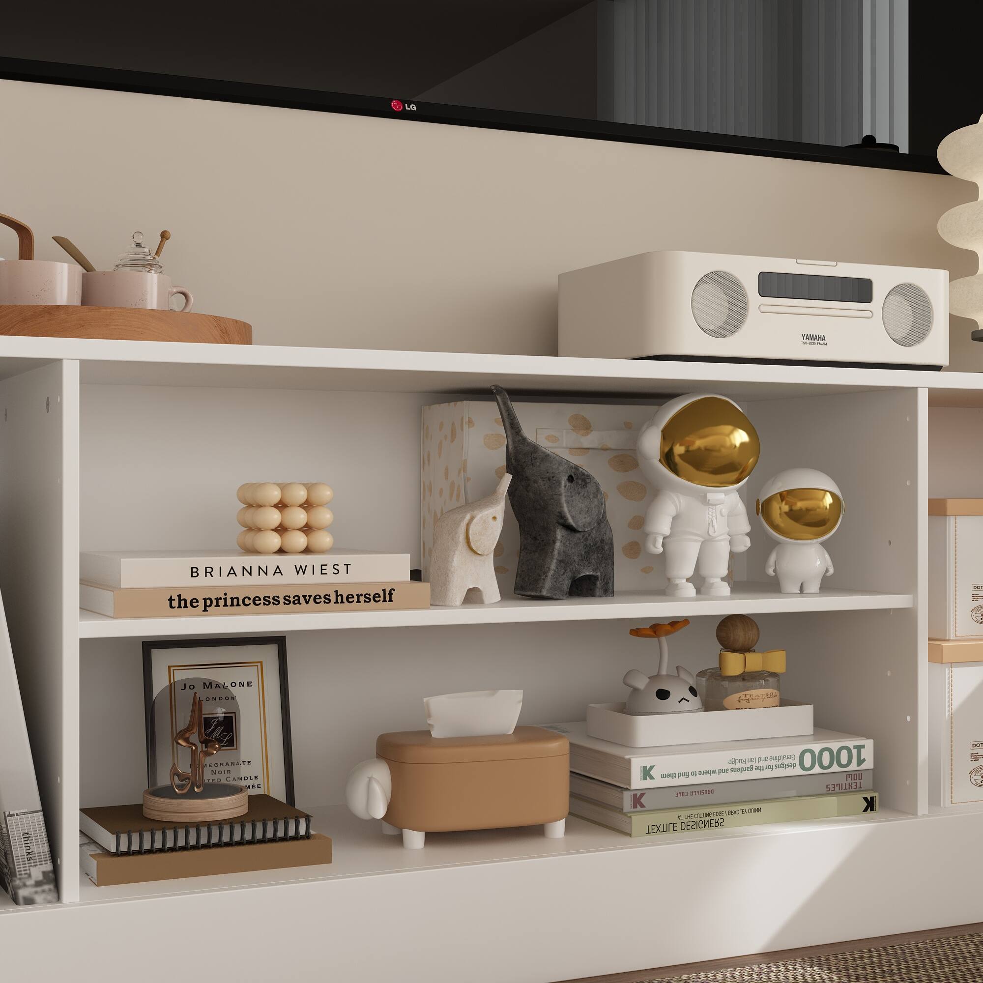 The text on the image can be grouped and corrected as follows:

1. The princess saves herself - Brianna Wiest
2. Jo Malone
3. 1000 Knots
4. Textile Designer

These sentences are related to the shelf and its contents, providing context and information about the items displayed.