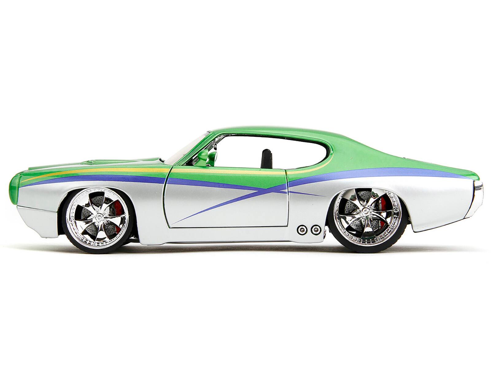 Left. Jada - 1969 Pontiac GTO Judge Green Metallic and Silver with Stripes "Bigtime Muscle" Series 1/24 Diecast Model Car by Jada - Green Metallic And Silver.