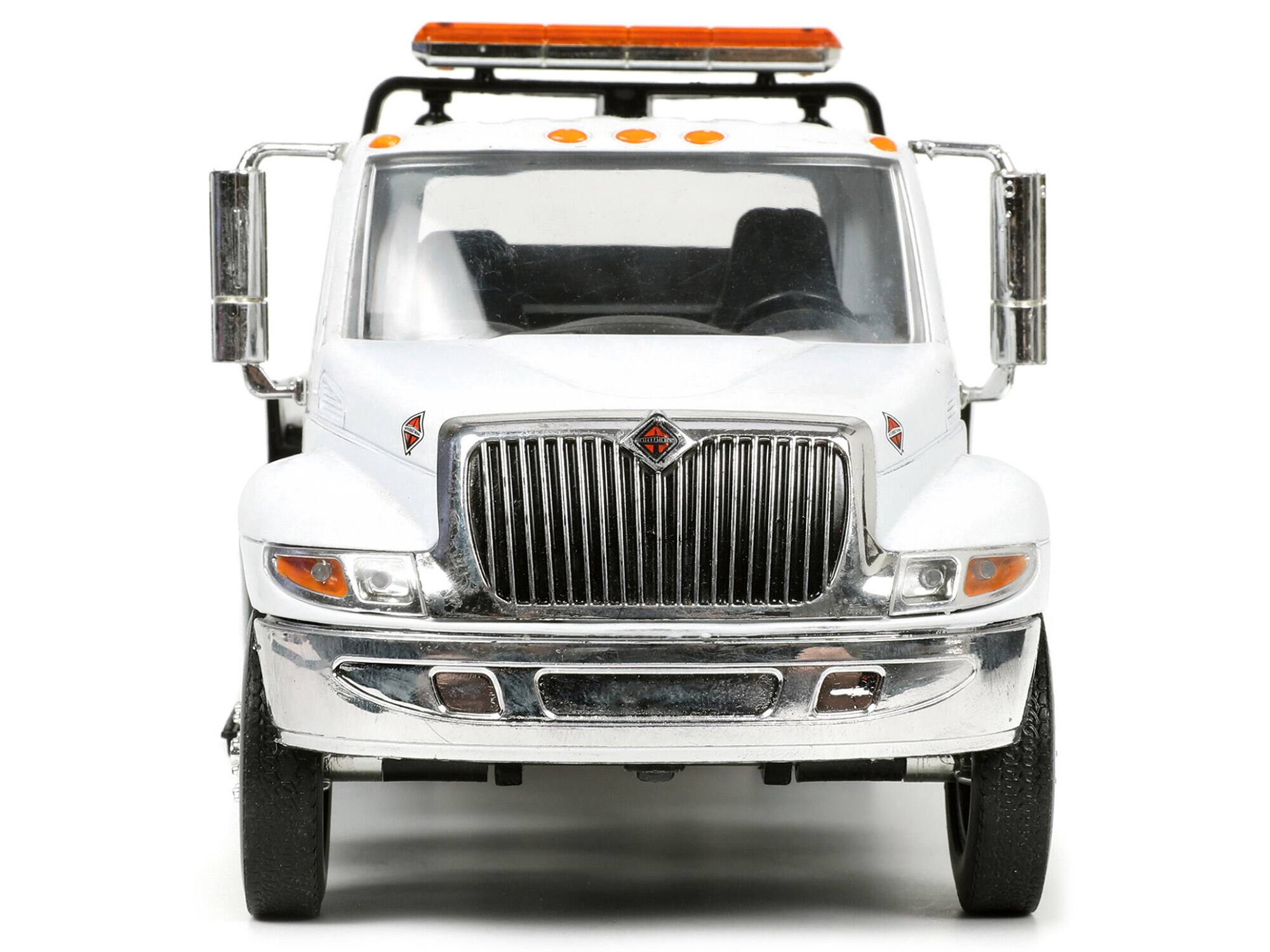 Alt View 4. Jada - International DuraStar 4400 Flatbed Tow Truck White 1/24 Diecast Model by Jada.