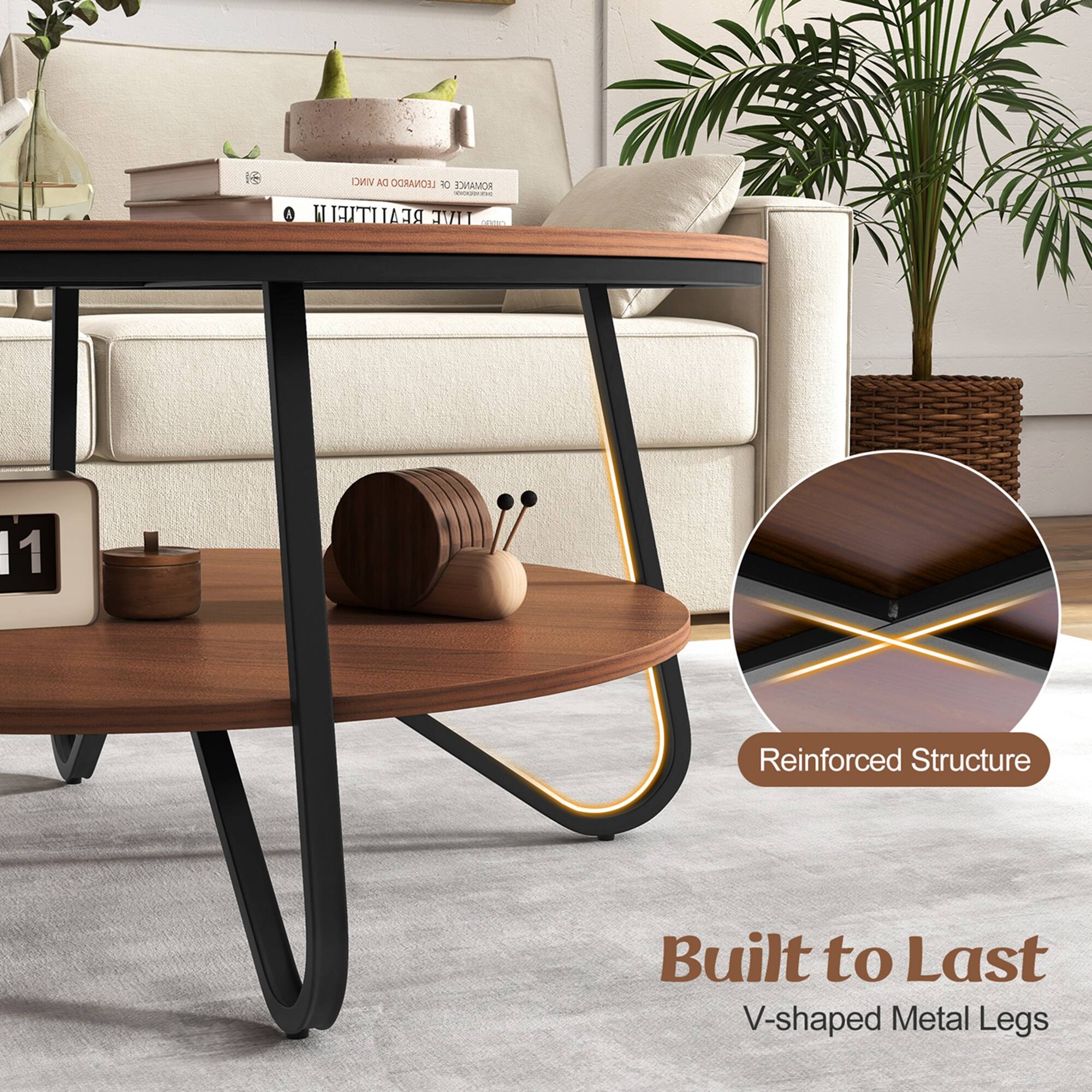 The image features a wooden coffee table with a reinforced structure, built to last. The table has a V-shaped metal leg design, which adds to its durability. The table is placed on top of a rug, and there are several books and a clock on it. Additionally, there are two potted plants in the room, one on the left side and the other on the right side. The scene is set in a living room, with a couch in the background.