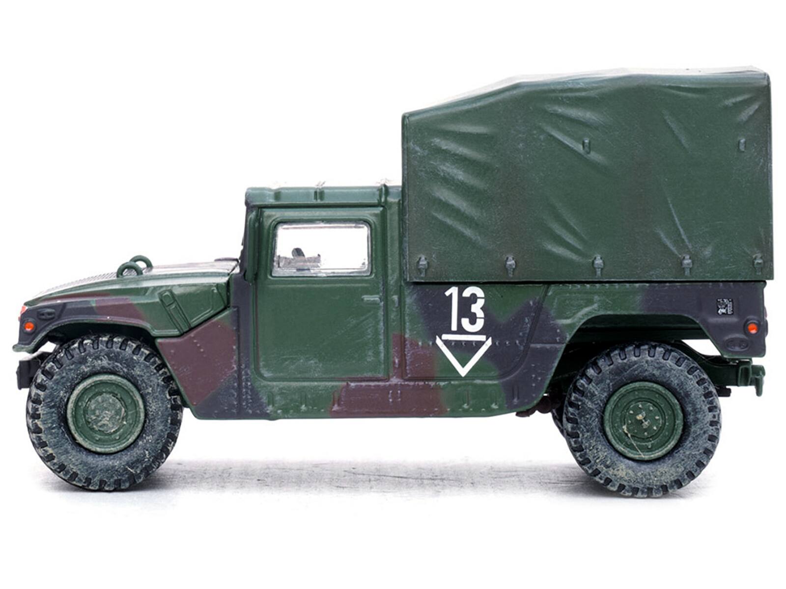 Left. Panzerkampf - M998 HMMWV 2nd Battalion 3rd FA Reg 1st Armored Division Germany 1999 U.S. Army Military Miniature Series 1/64 - Green.