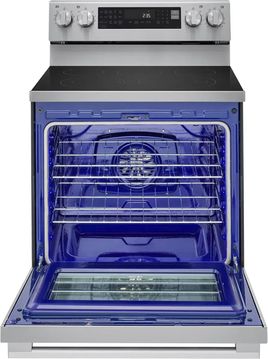 The oven is blue and silver and has a digital display. The oven door is open, revealing the interior. The oven is a stove top oven with a timer and clock on the front.