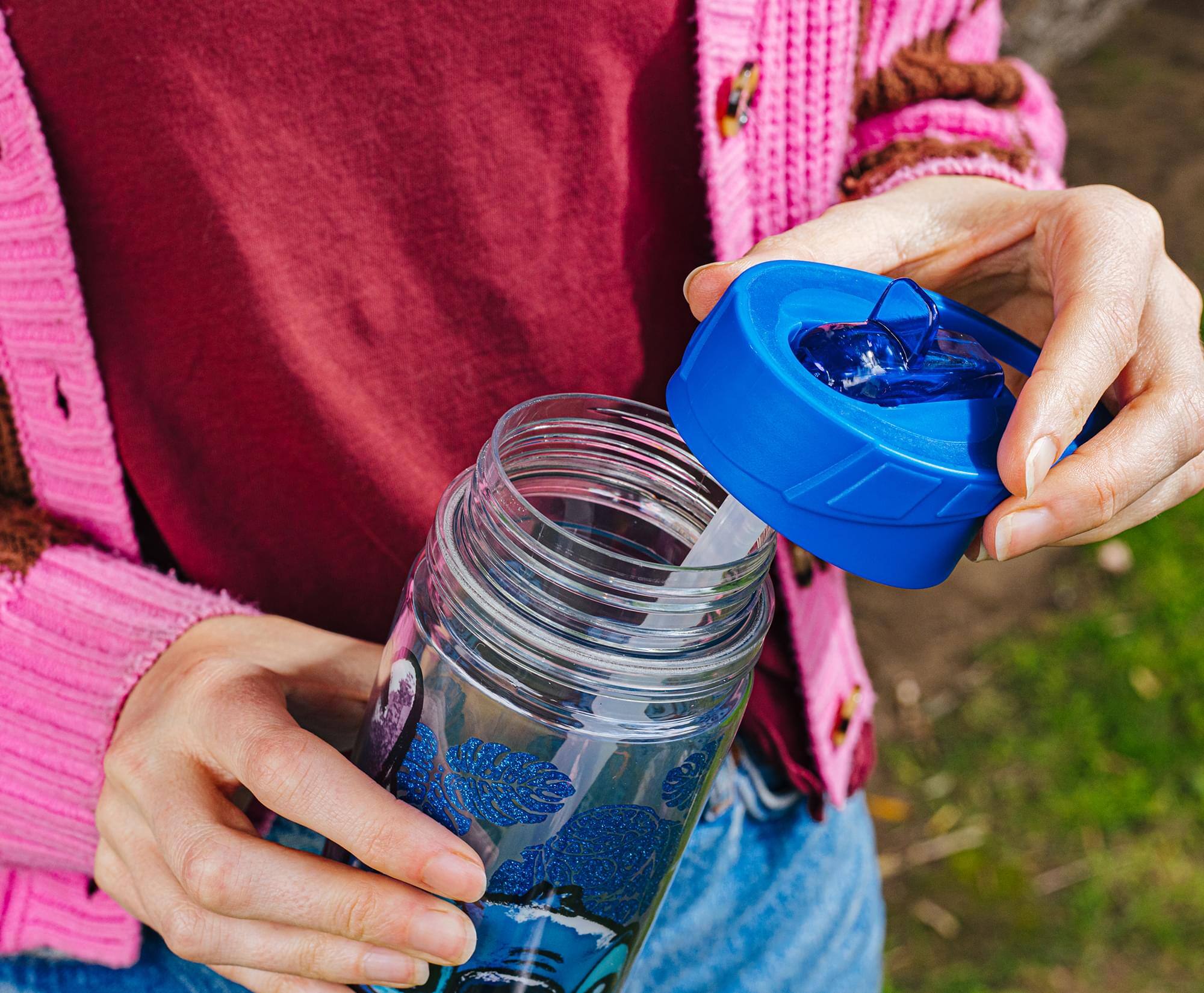 Alt View 2. Silver Buffalo - Disney Lilo & Stitch Floral Glitter Plastic Water Bottle | Holds 18 Ounces - Multi-Colored.