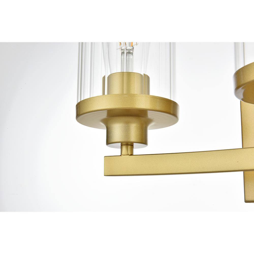 Angle. Living District - Saanvi 3 light Brass and Clear Bath Sconce - Brass And Clear.