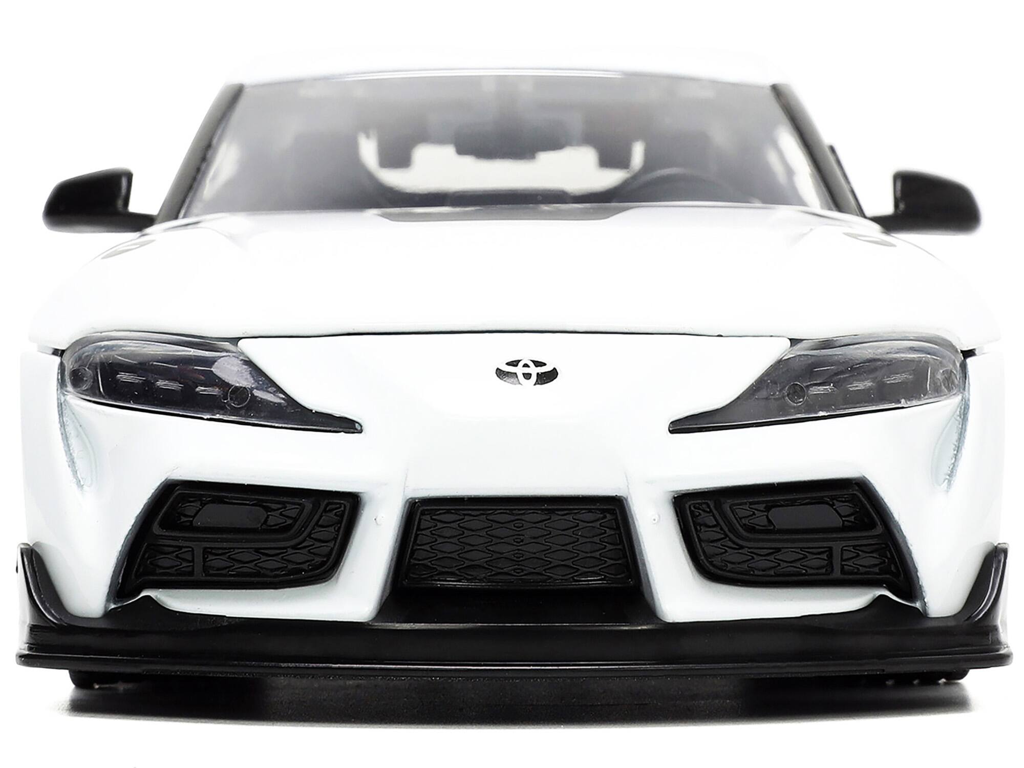 Alt View 4. Jada - 2020 Toyota Supra White and Rick Hunter Figurine "Robotech" "Hollywood Rides" Series 1/24 Model Car by Jada.