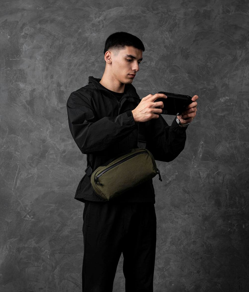 Left. ALPAKA - Gaming Sling Bag for Switch 2/Steam Deck/ROG Ally, Game Card Holder (20), 3.5L EDC Crossbody, Water-Resistant - Green Axoflux 400D Washed Nylon.