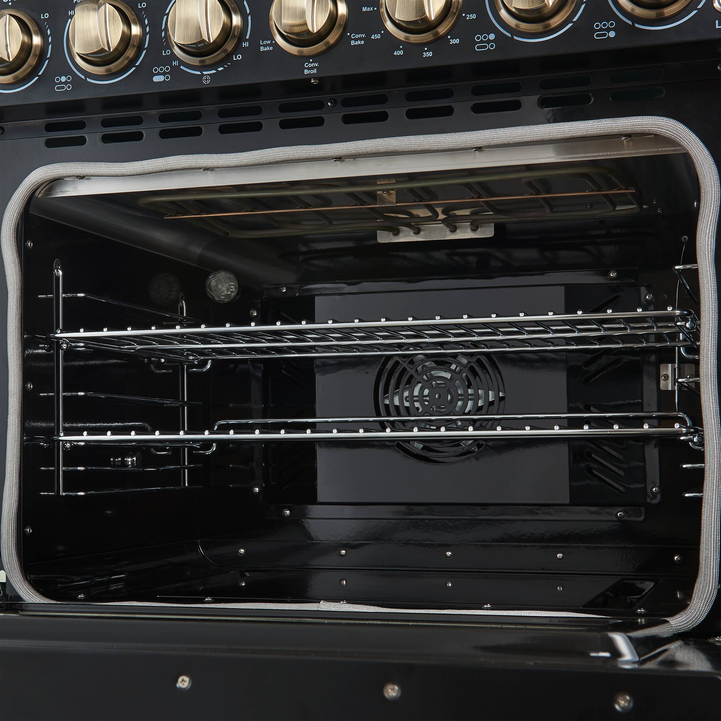 I cannot group or correct the text as it does not appear to be related to the image. The image shows a black oven with its door open, revealing the interior.