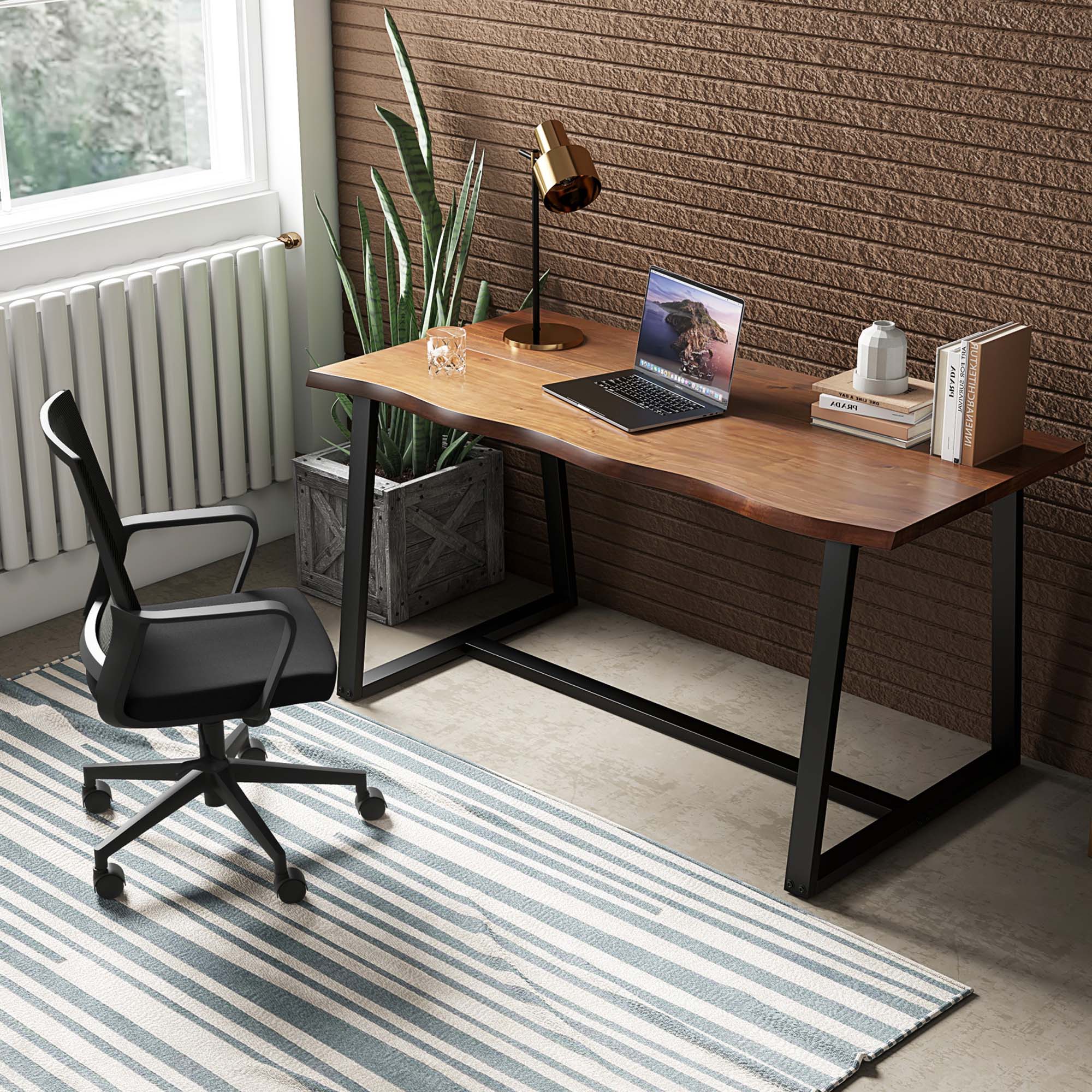 The image features a desk with a laptop on it, placed in front of a window. The desk is accompanied by a chair, and there is a potted plant nearby. Additionally, there are several books on the desk, and a cup can be seen on the surface. The scene appears to be a comfortable workspace with a view of the outdoors.