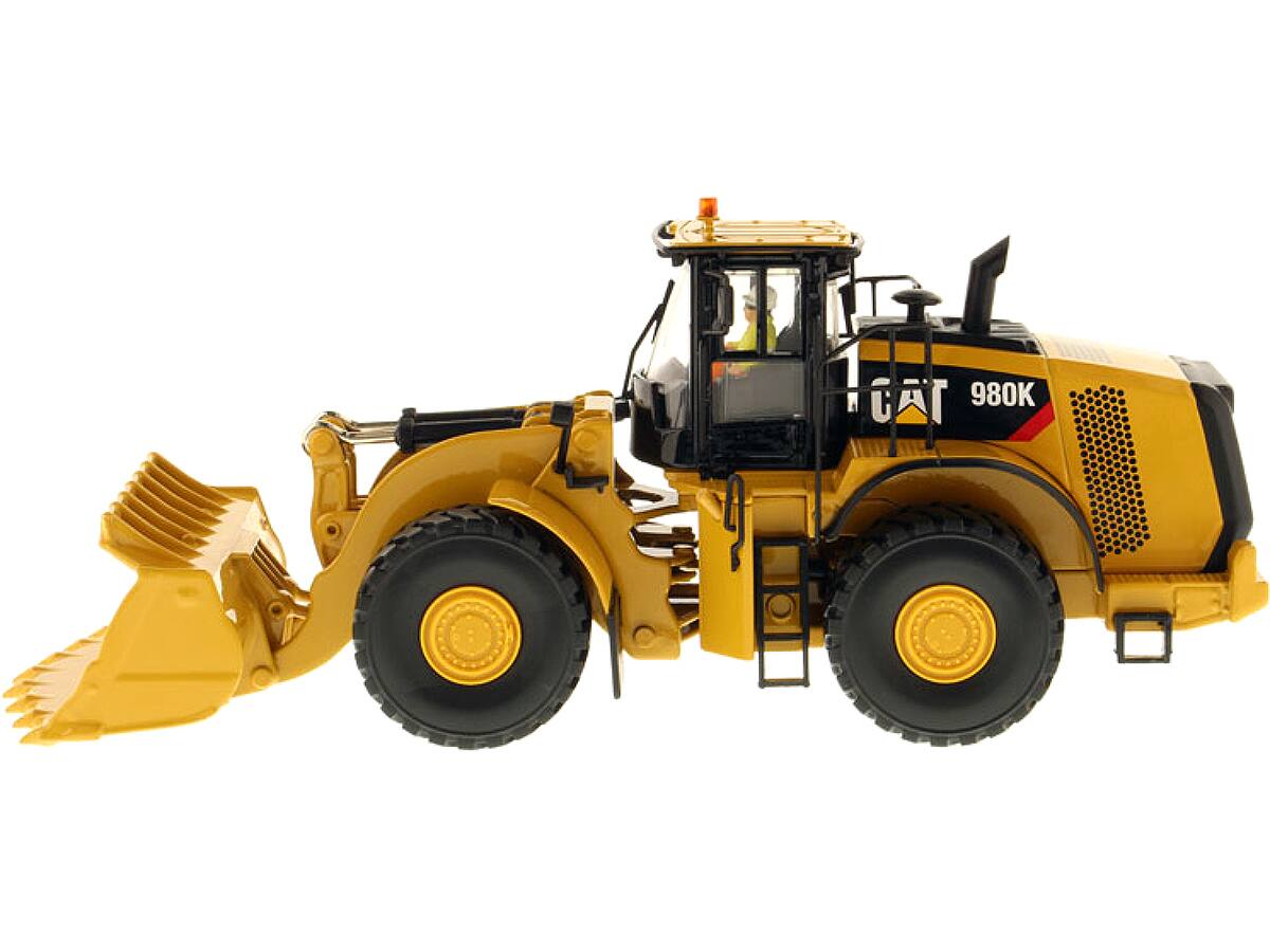 Angle. Diecast Masters - CAT Caterpillar 980K Wheel Loader Rock Configuration with Operator "Core Classics Series" 1/50 Diecast - Yellow .
