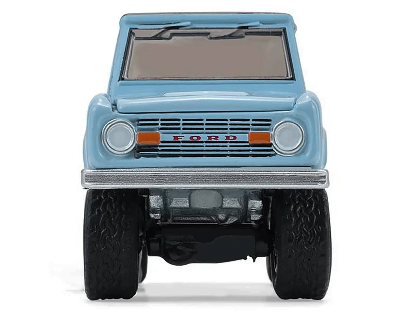 Alt View 1. Greenlight - 1972 Ford Bronco Custom SUV Light Blue with Black Top "Barrett-Jackson" Series 16 1/64 Diecast Model Car by Greenlight - Light Blue and Black.