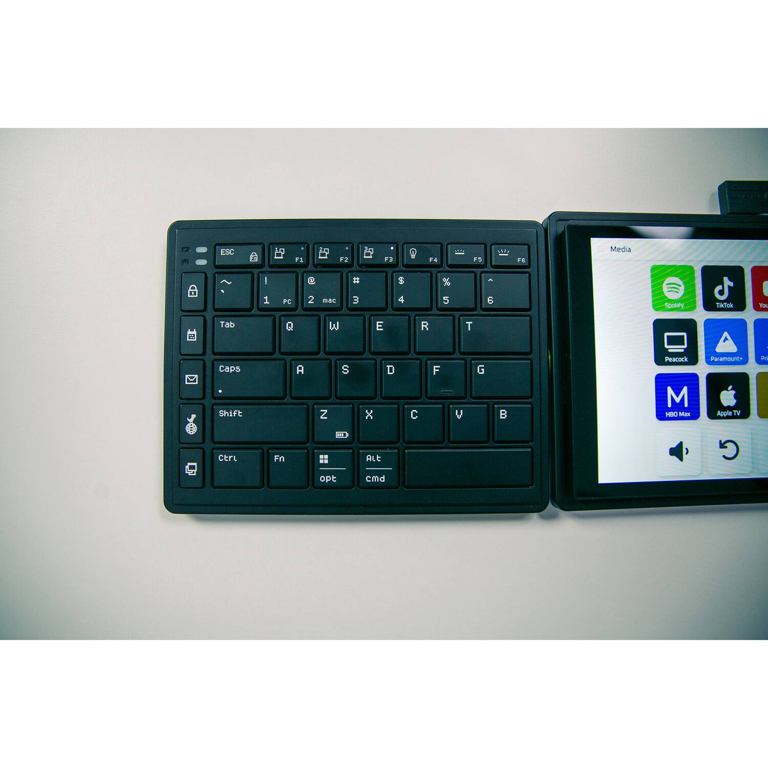 ESC . i F  3  .4  1n  FE Medaa I 9 = $ % - 1 FC 2 mas 3 4 5 5 Spotiy TikTok - Tab Q W E R T Caps Shift A Z S x D  F y G B Peacuck M HSO san Paramounts Appie T in ctrL Fin ALE G oPE cmd