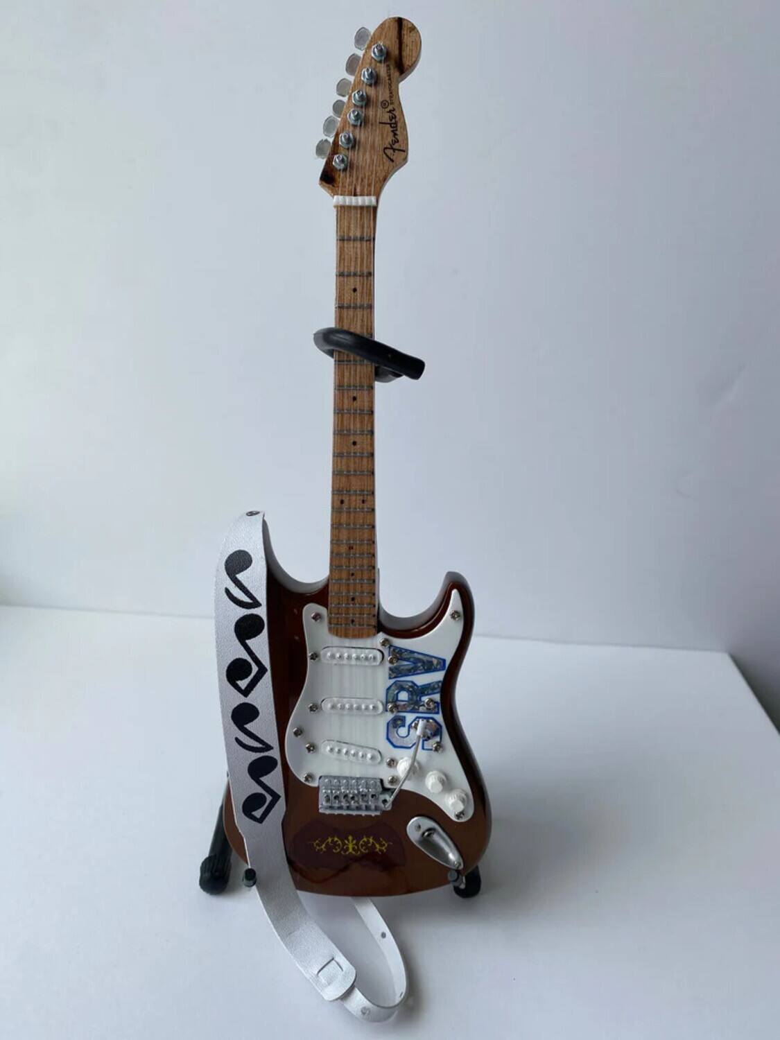 Alt View 2. Axe Heaven - Stevie Ray Vaughan - Axe Heaven Stevie Ray Vaughan SRV Musical Note White Mini Guitar Strap Replica - COLLECTIBLES - Multicolor.