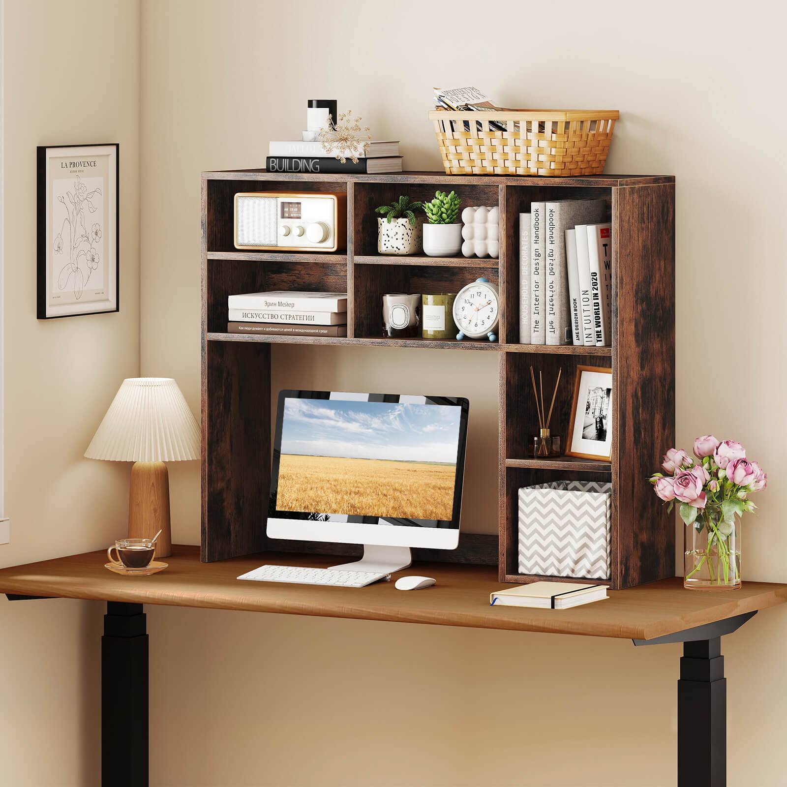 The image features a wooden desk with a computer, keyboard, and mouse on it. The desk is also adorned with various items such as books, a cup, a vase, a clock, and a potted plant. The books are arranged on the desk, with some placed on the left side and others on the right side. The cup is located near the left side of the desk, while the vase is positioned towards the right side. The clock is situated in the middle of the desk, and the potted plant is placed on the left side. The overall scene creates a cozy and organized workspace.