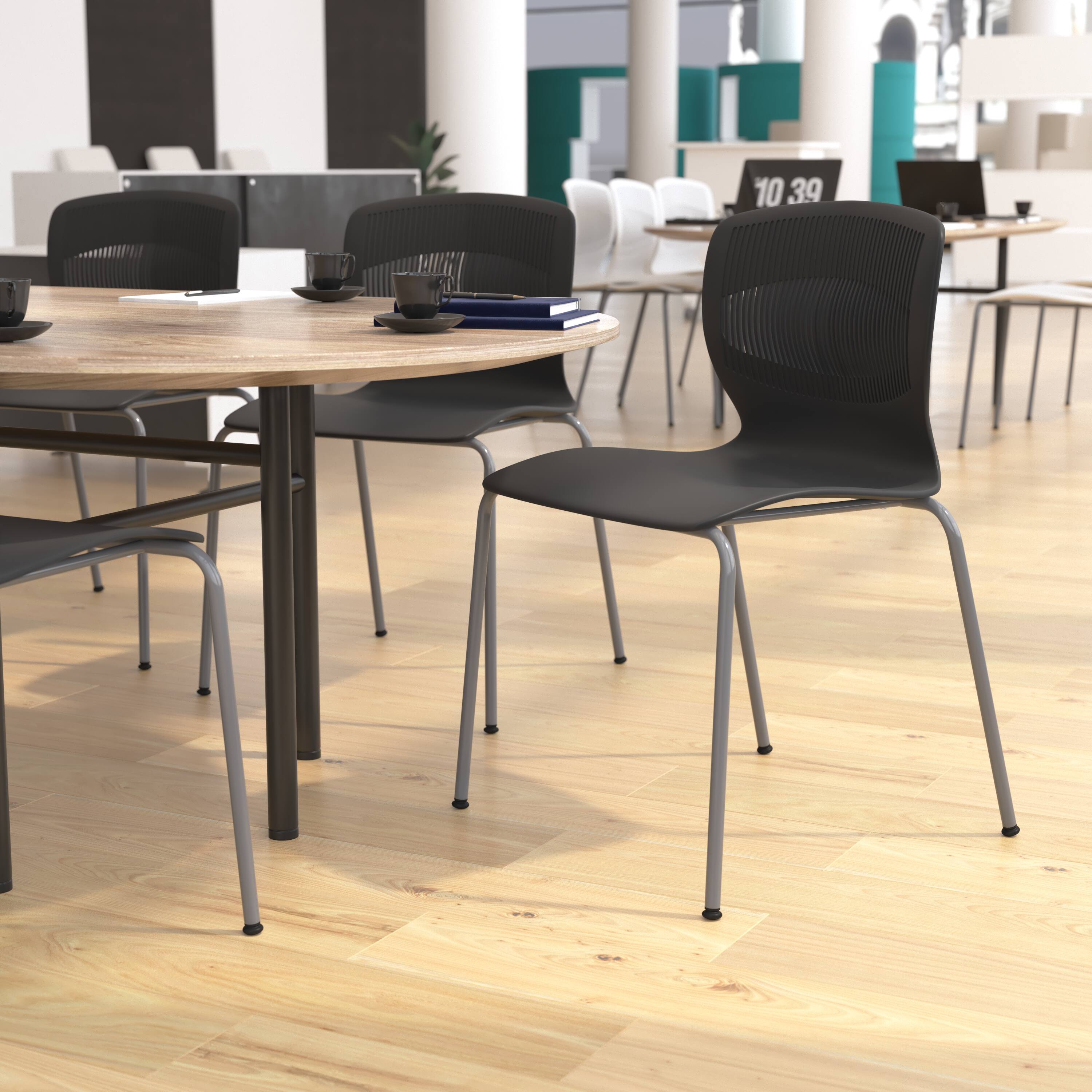 Alt View 1. Emma + Oliver - Arcana Series Heavy Duty 770 lb. Capacity Ergonomic Polypropylene Stack Chair with Lumbar Support and Steel Frame - Black.