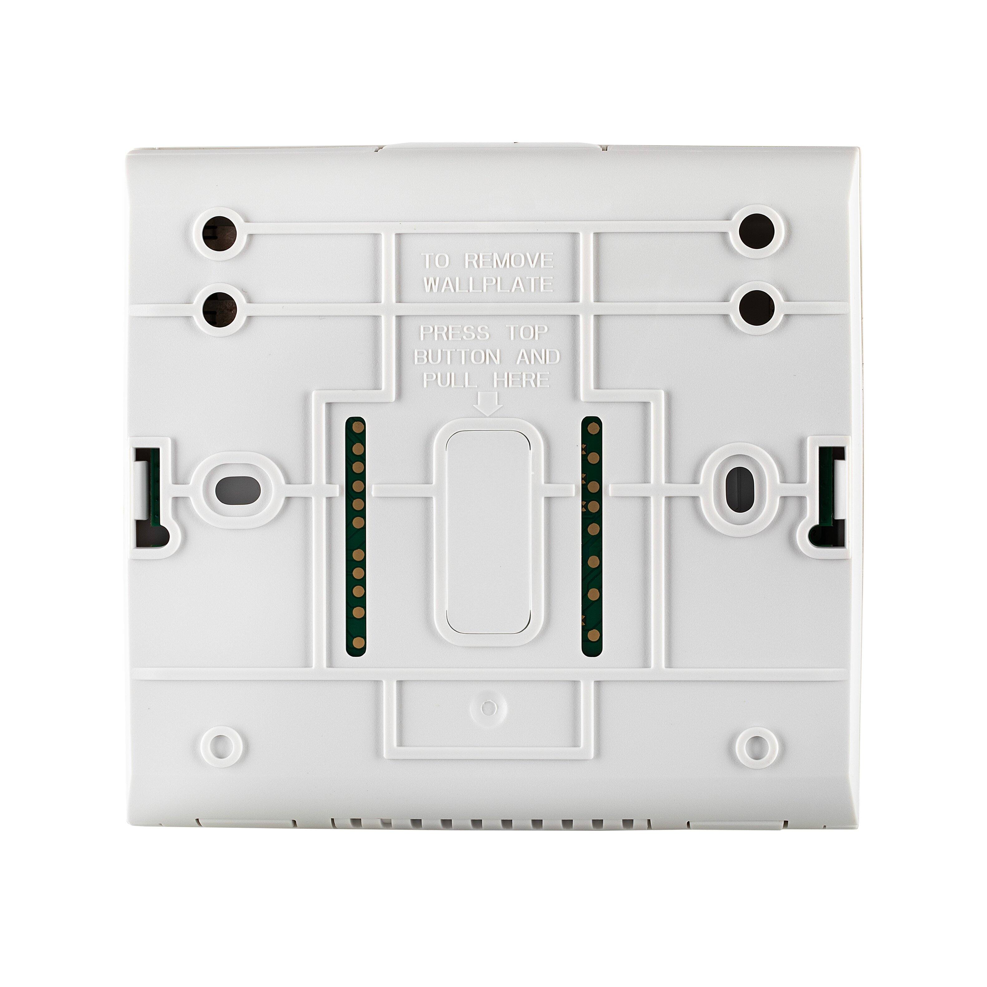 To remove wallplate, press top button and pull here.