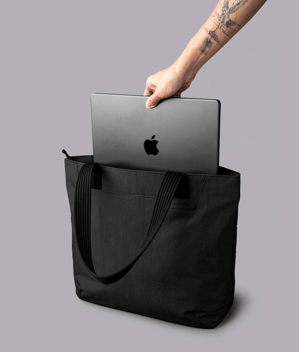 Alt View 4. ALPAKA - Flight Tote (L) Laptop Tote Bag for Work, Large Tote Bag Fits 16" MacBook Pro, Water Bottle Pocket, Luggage Pass-Through - Black Axoflux 400D.