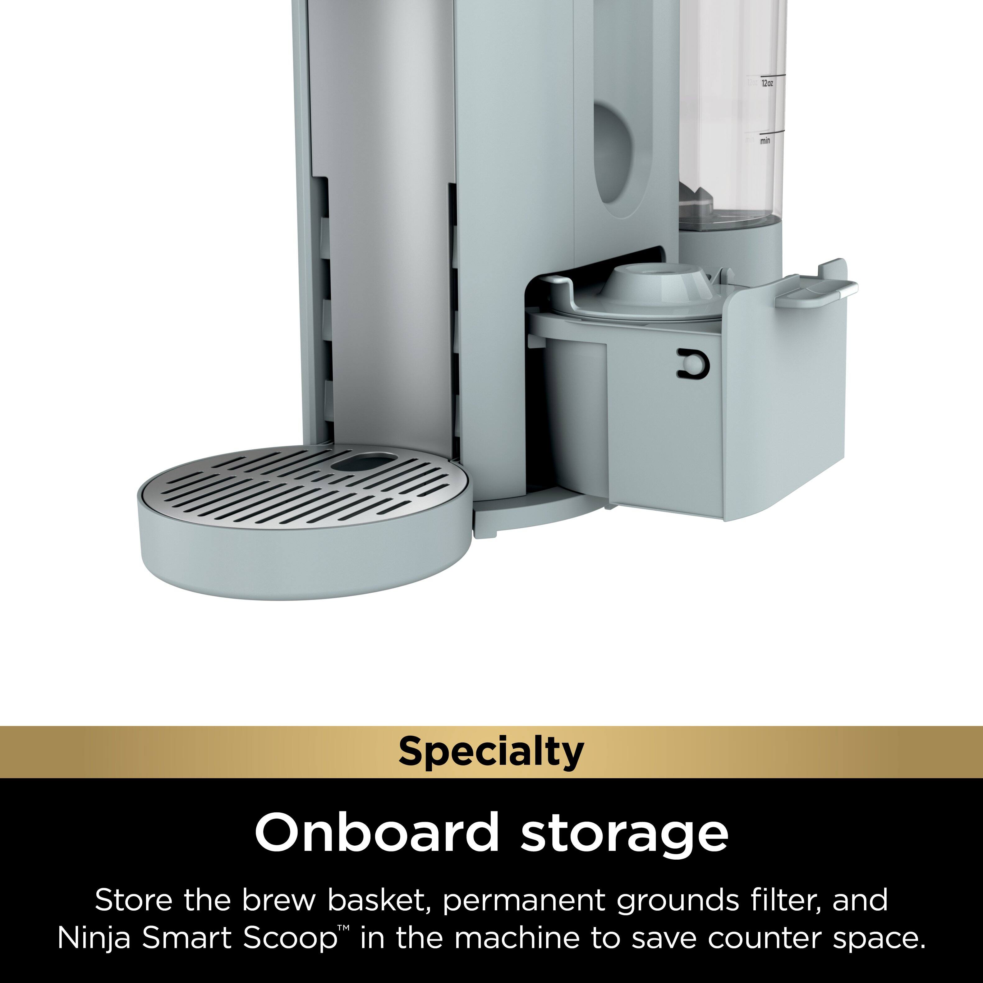 The image features a modern coffee maker with a specialty onboard storage. It allows users to store the brew basket, permanent grounds filter, and Ninja Smart Scoop in the machine to save counter space. The coffee maker is designed to be efficient and space-saving, making it a convenient addition to any kitchen or office environment.