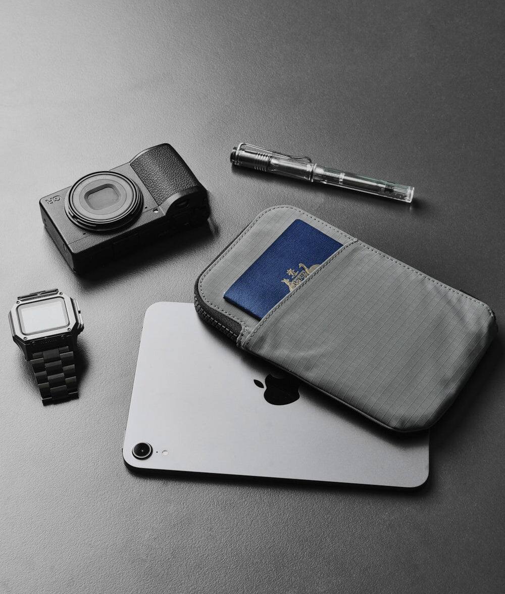 Alt View 1. ALPAKA - Zip Travel Wallet - RFID Passport Holder, Self Locking Zipper Wear,3 passport pockets and 2 Card Slots - Grey Axoflux 210D.