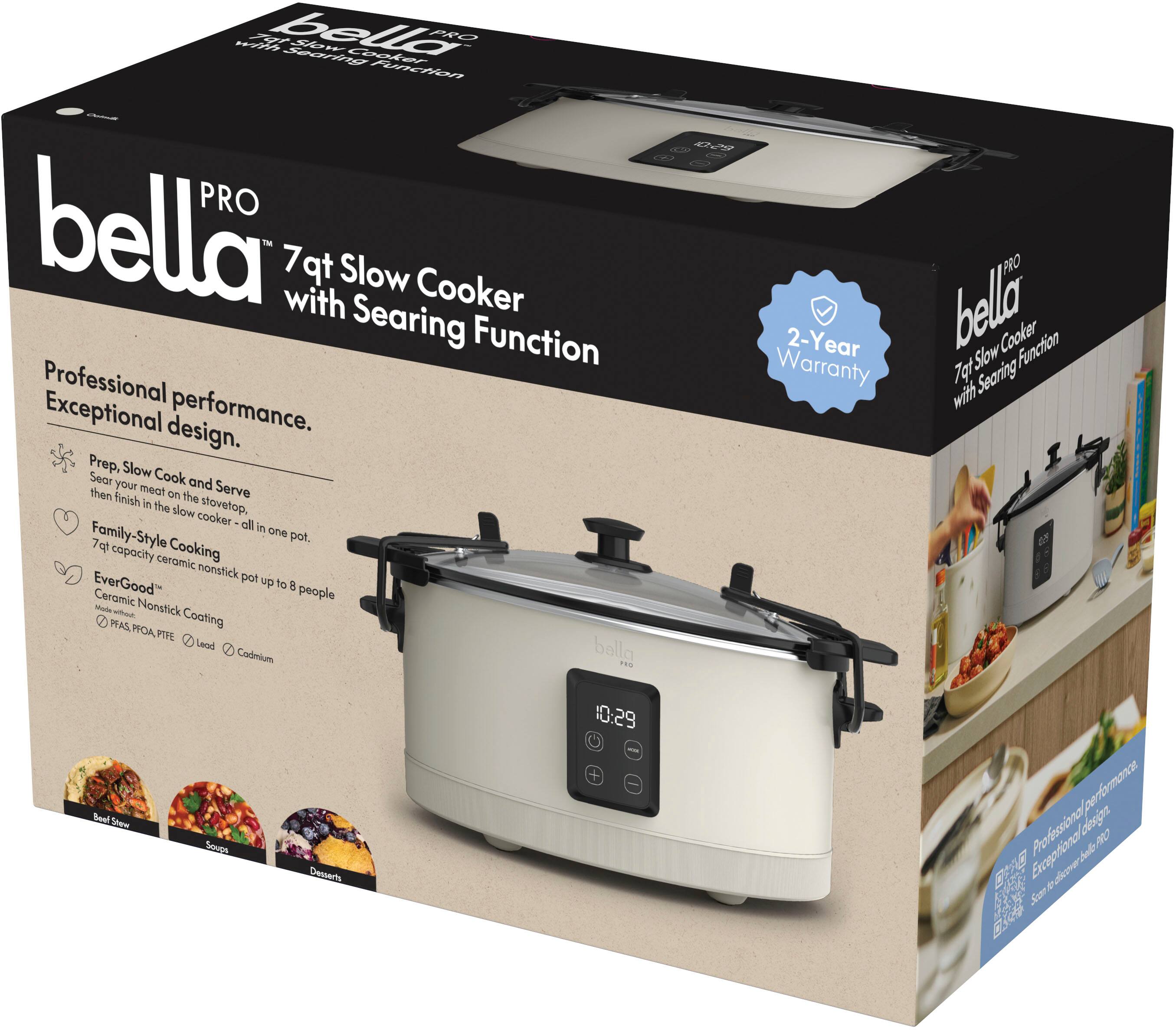 The box for the Bella Pro 7-qt slow cooker with searing function includes a professional design, exceptional performance, and a 2-year warranty. The cooker is made of ceramic nonstick material and can be used for both slow cooking and searing. It is suitable for family-style cooking and has a large 7-quart capacity. The box also features images of the cooker in use, showcasing its versatility and ease of use.