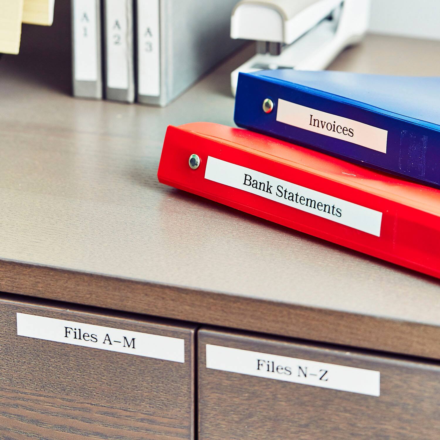 The text on the image reads: "Invoices Bank Statements Files A-M Files N-Z."