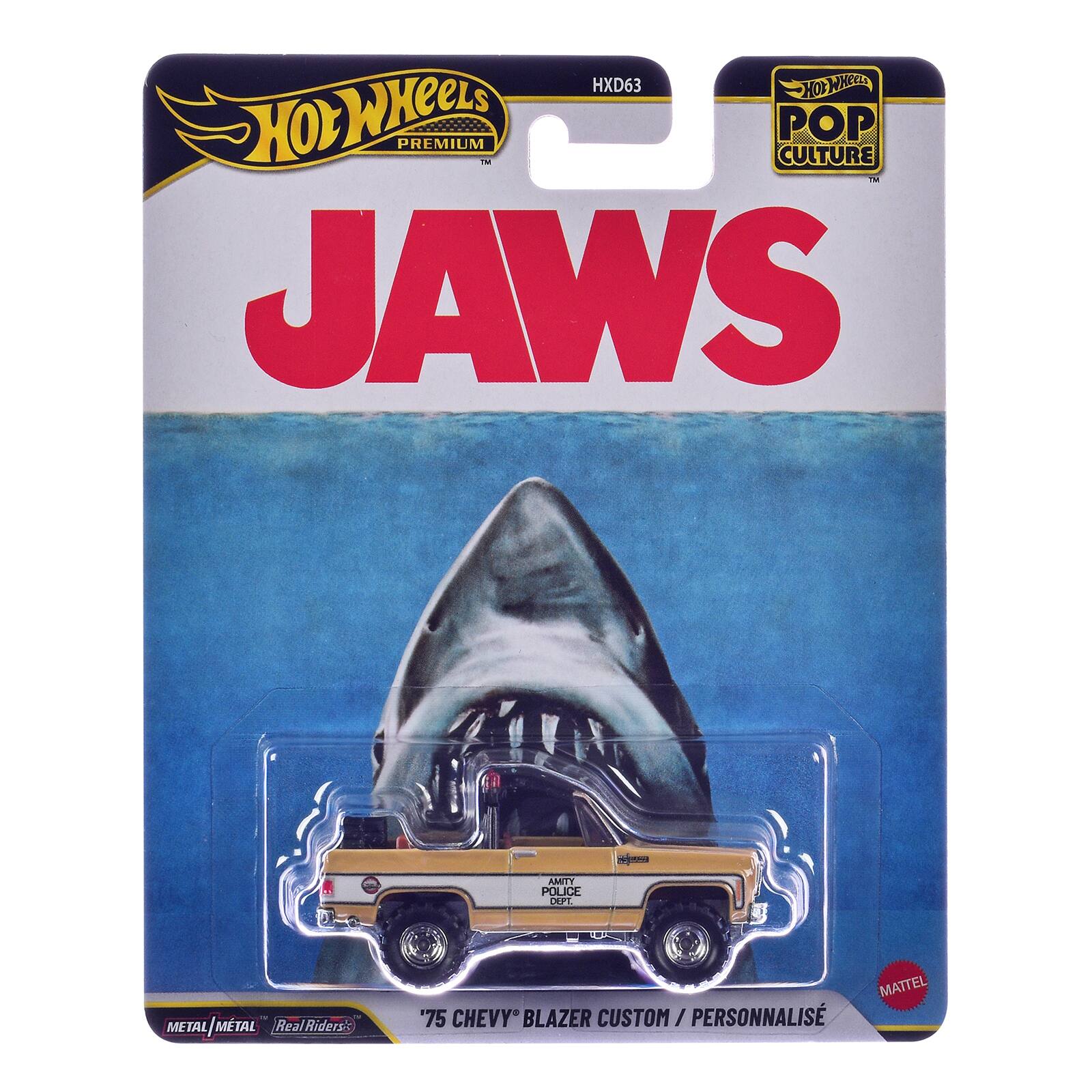 HXD63 Hot Wheels Hot Wheels PREMIUM TM POP CULTURE M JAWS  
AMITY POLICE DEPT.  
METAL/MTAL Real Riders  
MATTEL '75 CHEVY BLAZER CUSTOM / PERSONNALISÉ