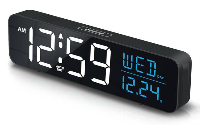 AM SNOOZE LIGHT 12:59 AUTO DST 12.24. WED DAY M D