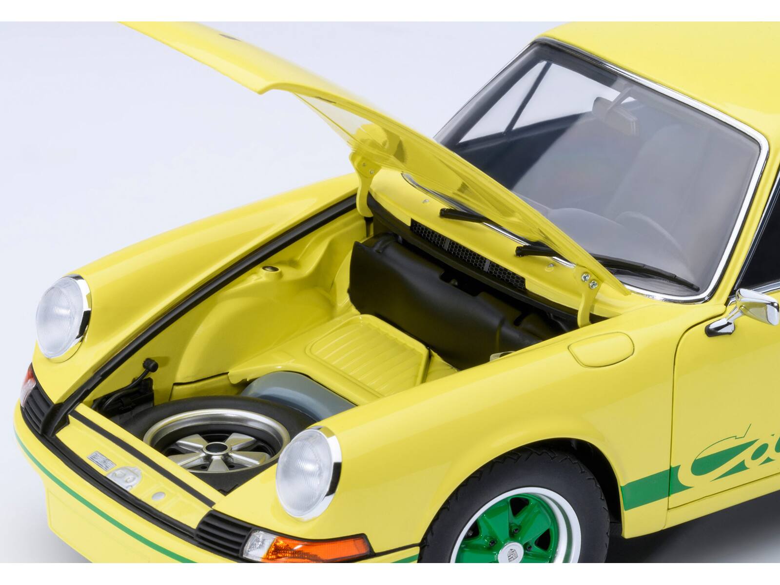 Left. Autoart - Porsche 911 Carrera 2.7 RS Light Yellow with Green Stripes and Wheels 1/18 Model Car by Autoart - Yellow.