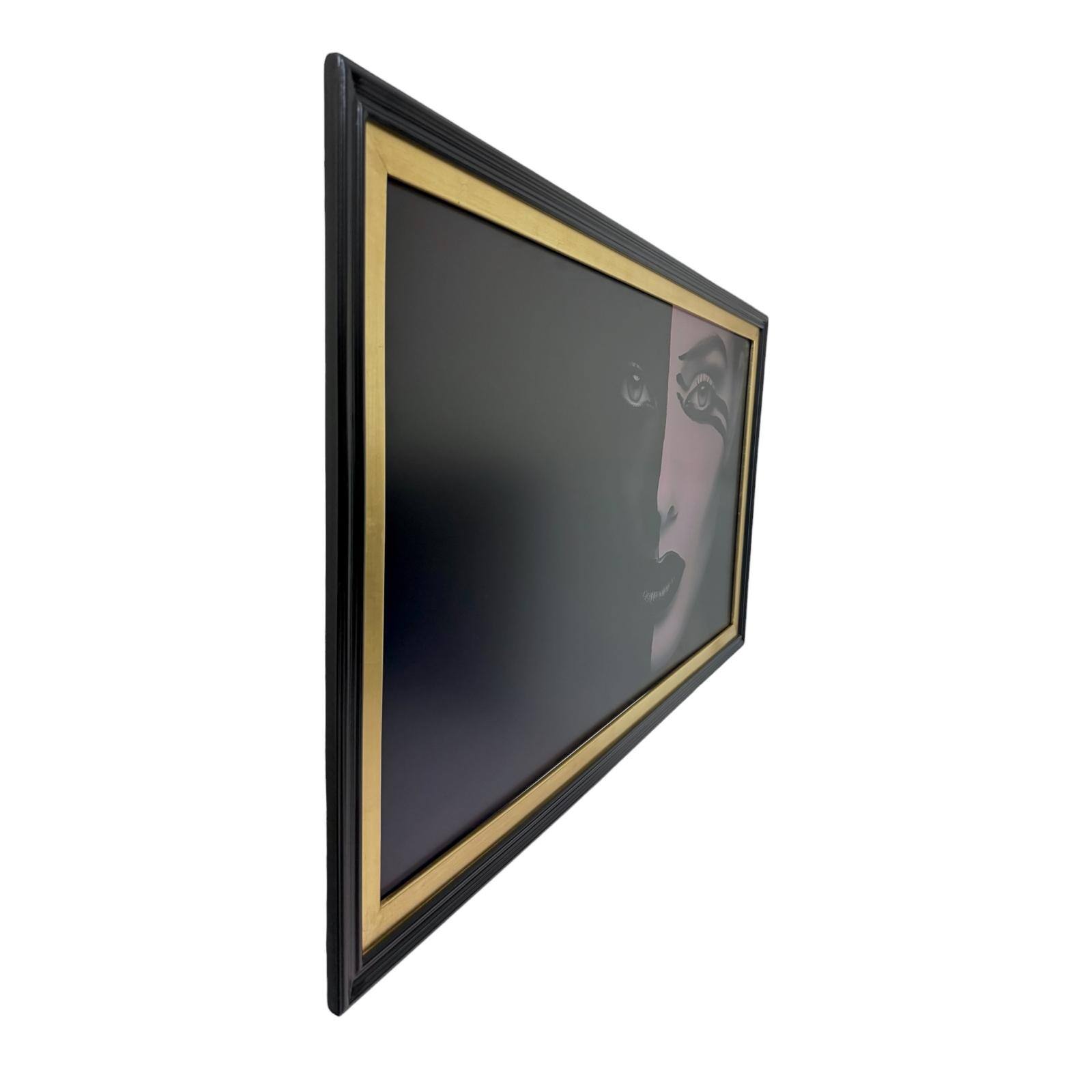 Angle. LAREDO FRAME FACTORY - 55 inch Handmade Tv Frame For TCL A300W NXTVISION Tv - SATIN BLACK WITH GOLD LEAF.