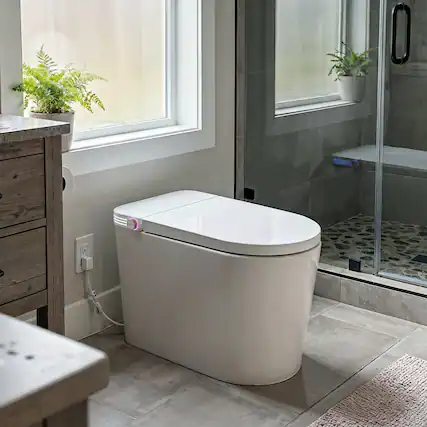 Front. TOTTE - Touchless Smart Toilet with Auto Lid & Auto Flush, Adjustable Bidet Wash, Heated Seat, Warm-Air Dryer, Emergency Flush - White.