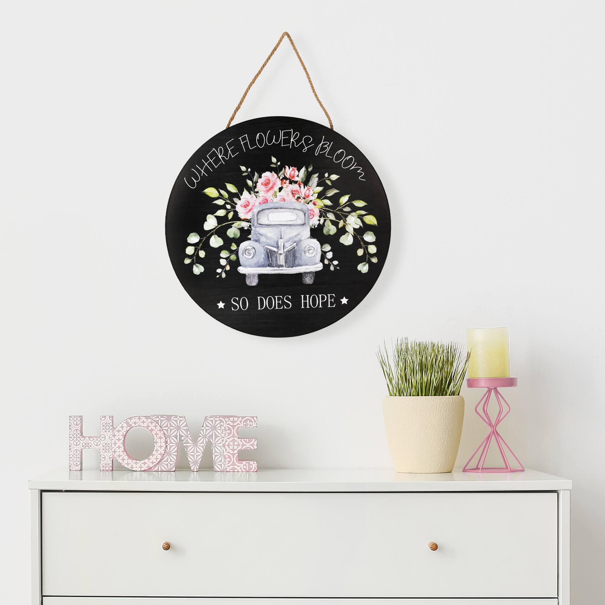 WHERE FLOWERS BLOOM  
SO DOES HOPE  

HOME