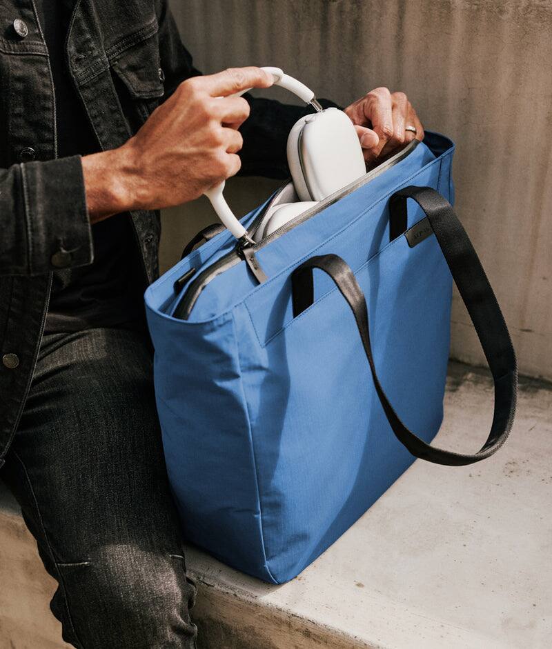Left. ALPAKA - Metro Tote Laptop Tote Bag for Work, Work Tote Fits 16" MacBook Pro, Side Bottle Pocket, Weather-Resistant, Key Tether - Blue Axoflux 210D.