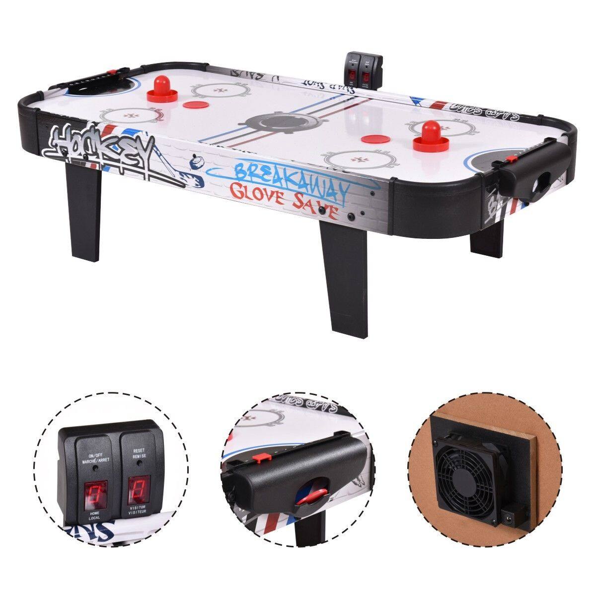 The image features a table with a game on it, which is a Breakaway Glove Save game. The table is black and white and has a fan underneath it. The game is designed for two players, and it is a tabletop game. The table is also equipped with a fan to keep the game cool.